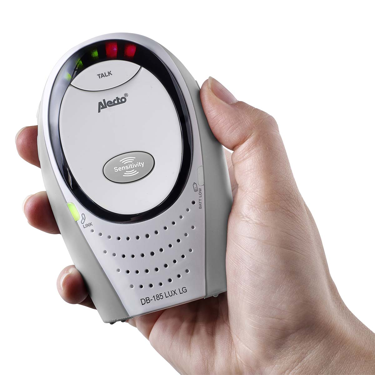 A hand holds a white baby monitor with red and green lights at the top.