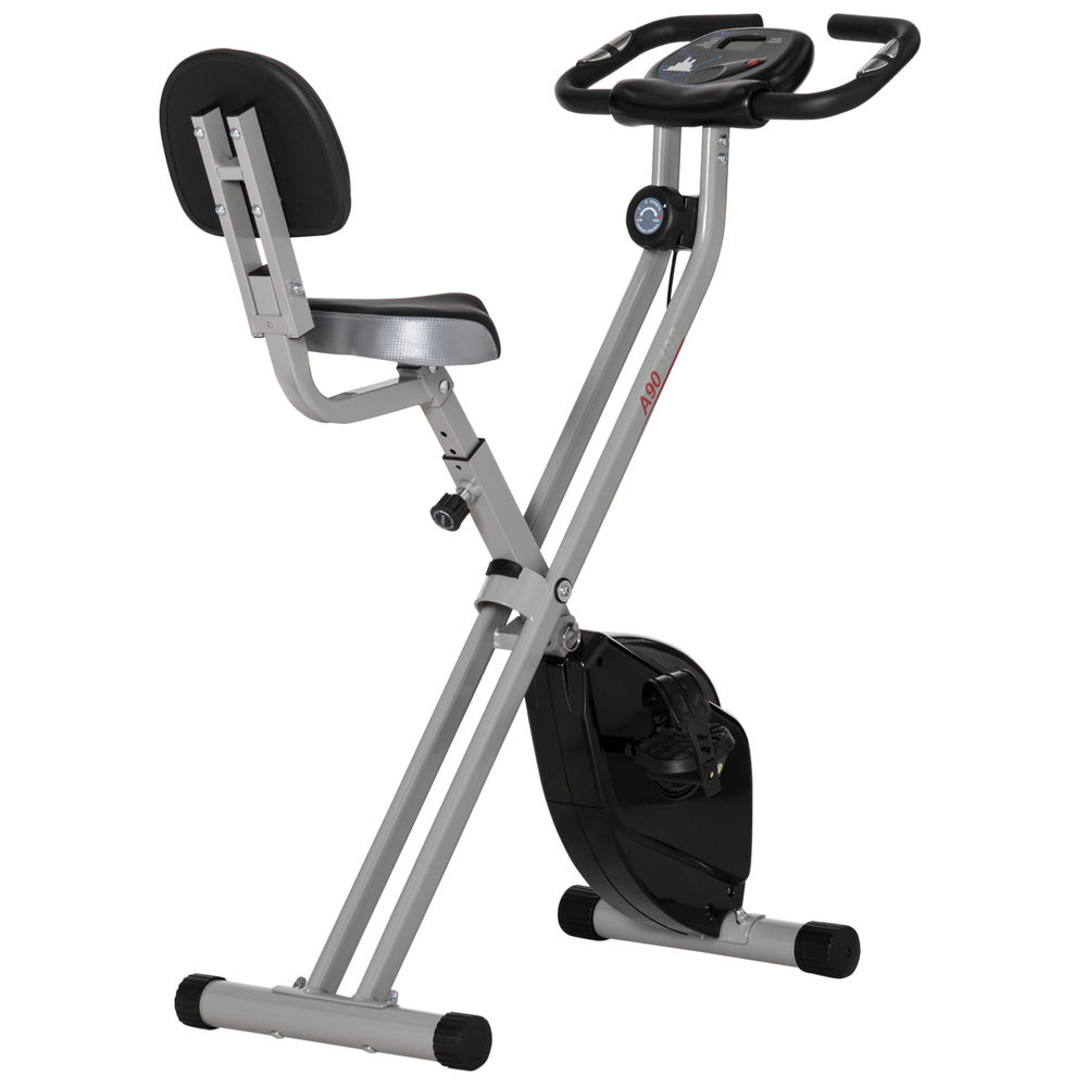 Una bicicleta estática plegable con marco gris, asiento y respaldo negros.