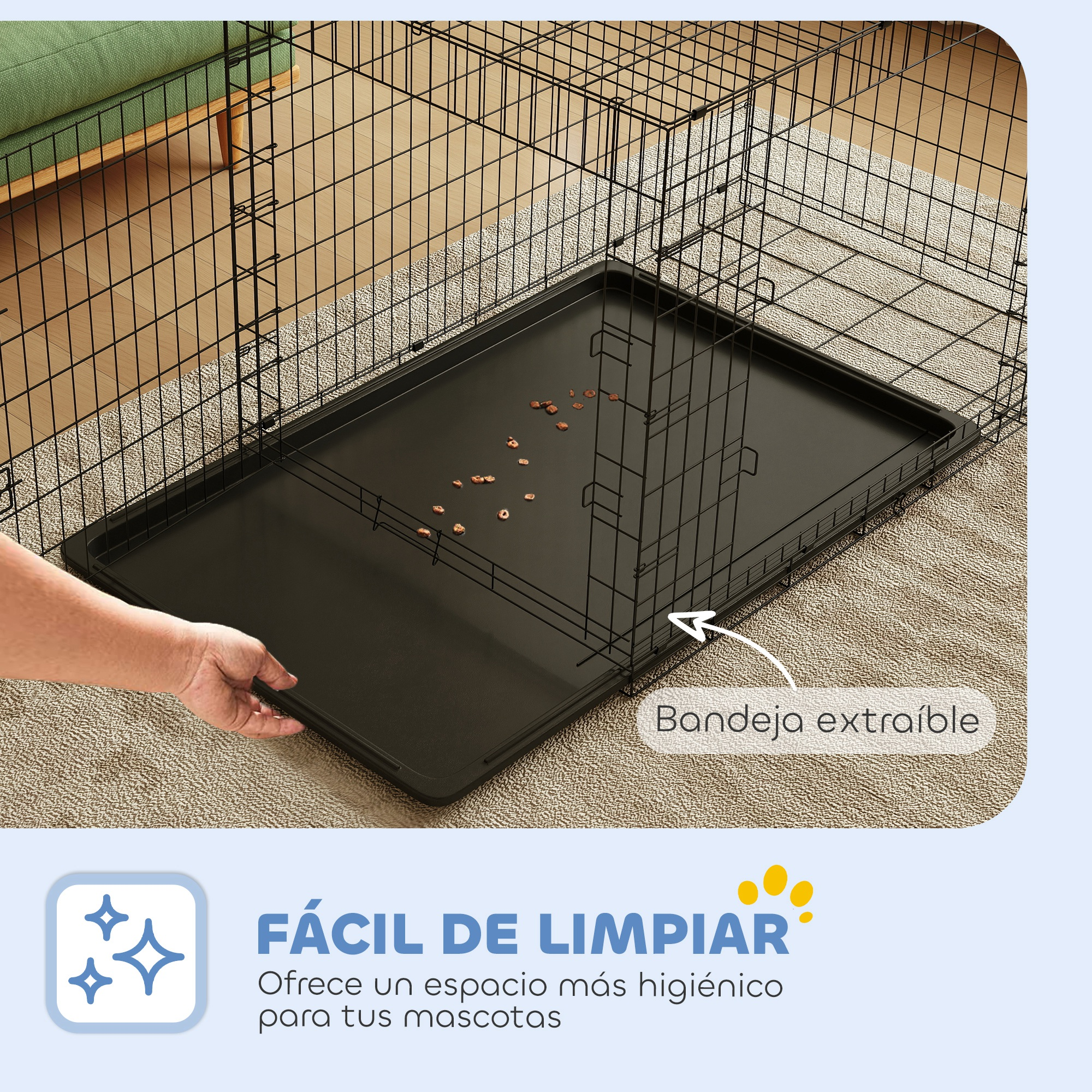 Una persona saca una bandeja extraíble de una jaula para perros.