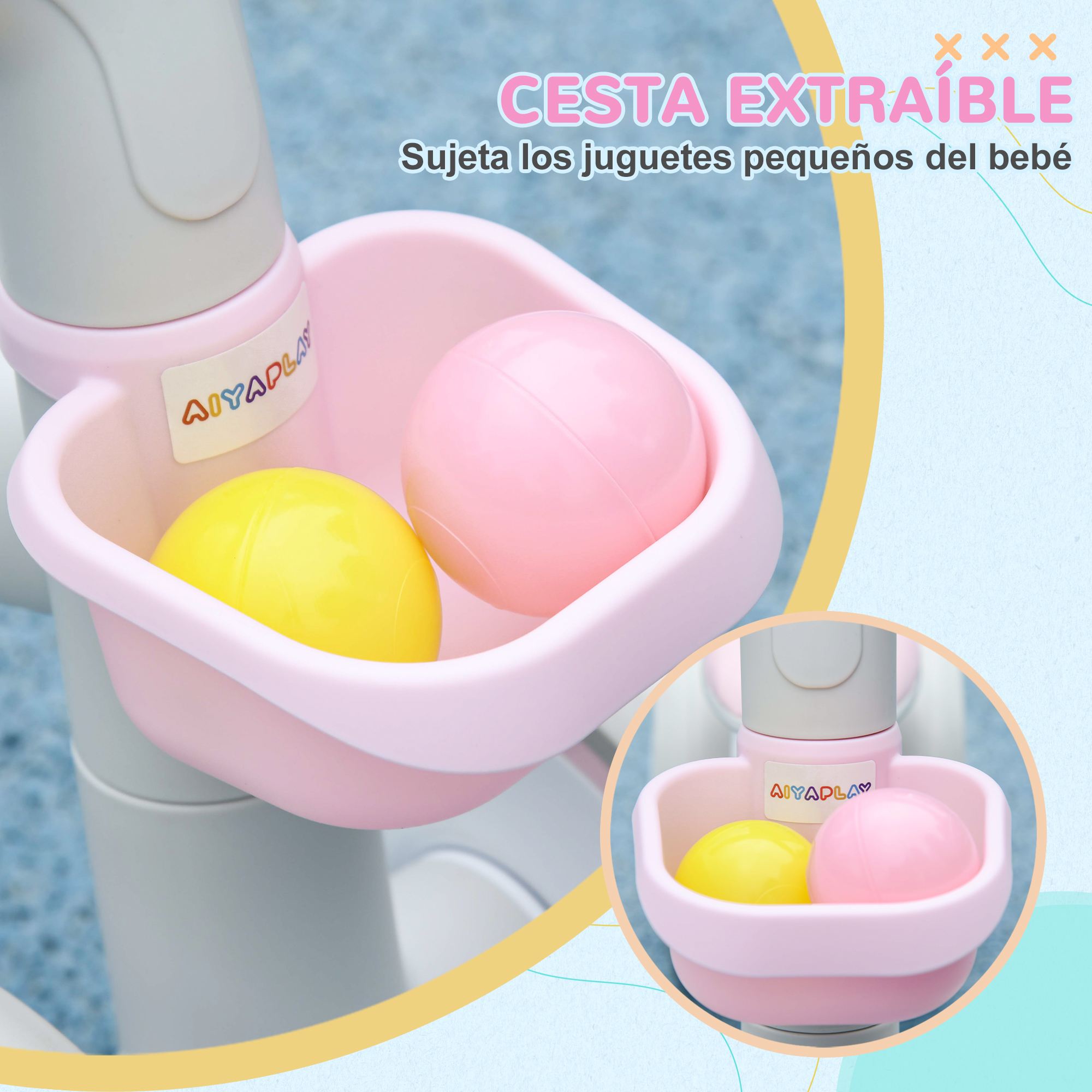 Una cesta rosa con bolas amarillas y rosas en un soporte gris.
