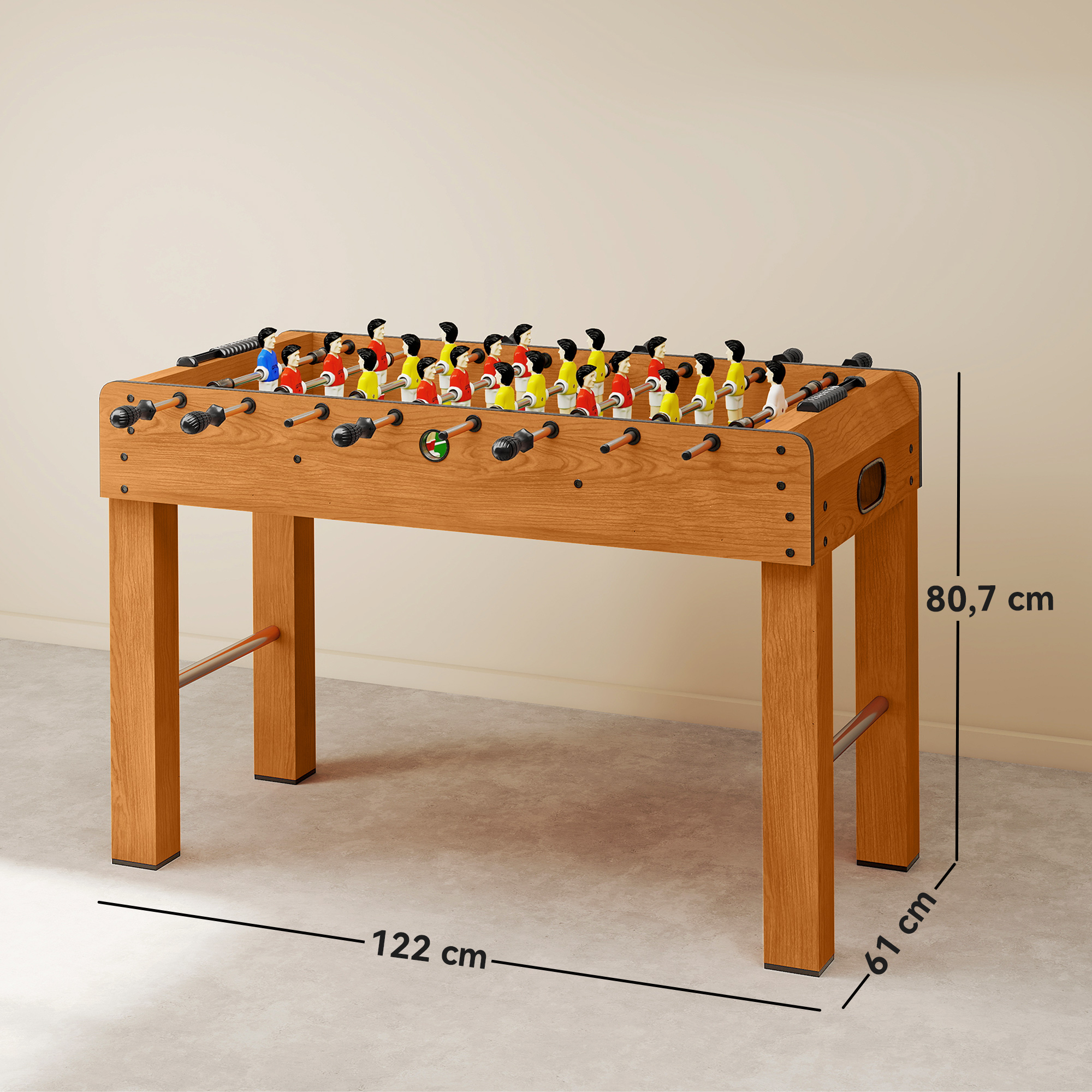 Una mesa de futbolín de madera con figuras de jugadores rojas, azules y amarillas.