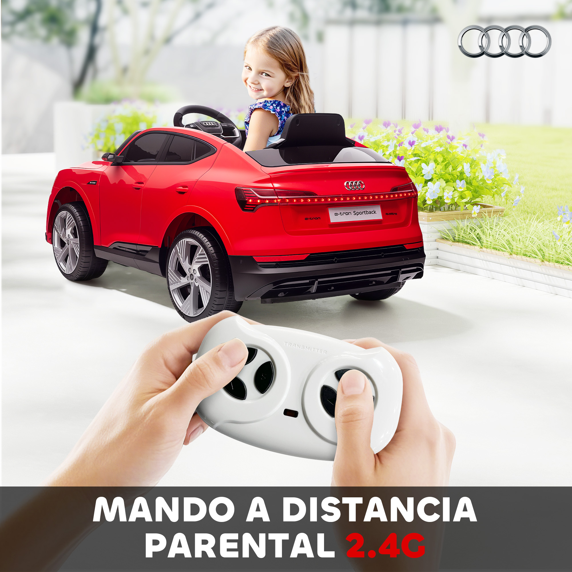 Un coche de juguete Audi rojo con una niña sentada, controlado por control remoto.