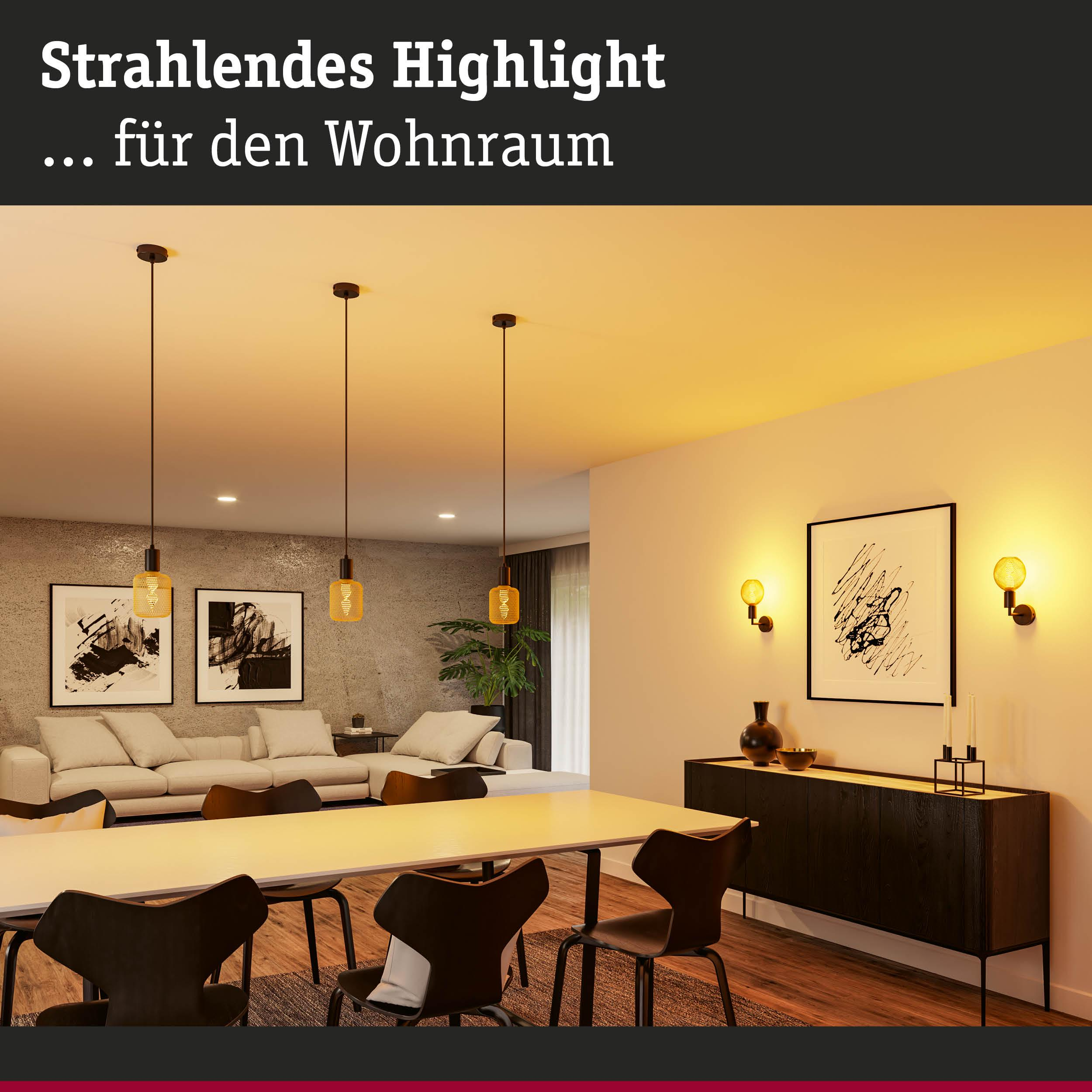 Nowoczesny salon ze stołem, sofą, sztuką i oświetleniem.