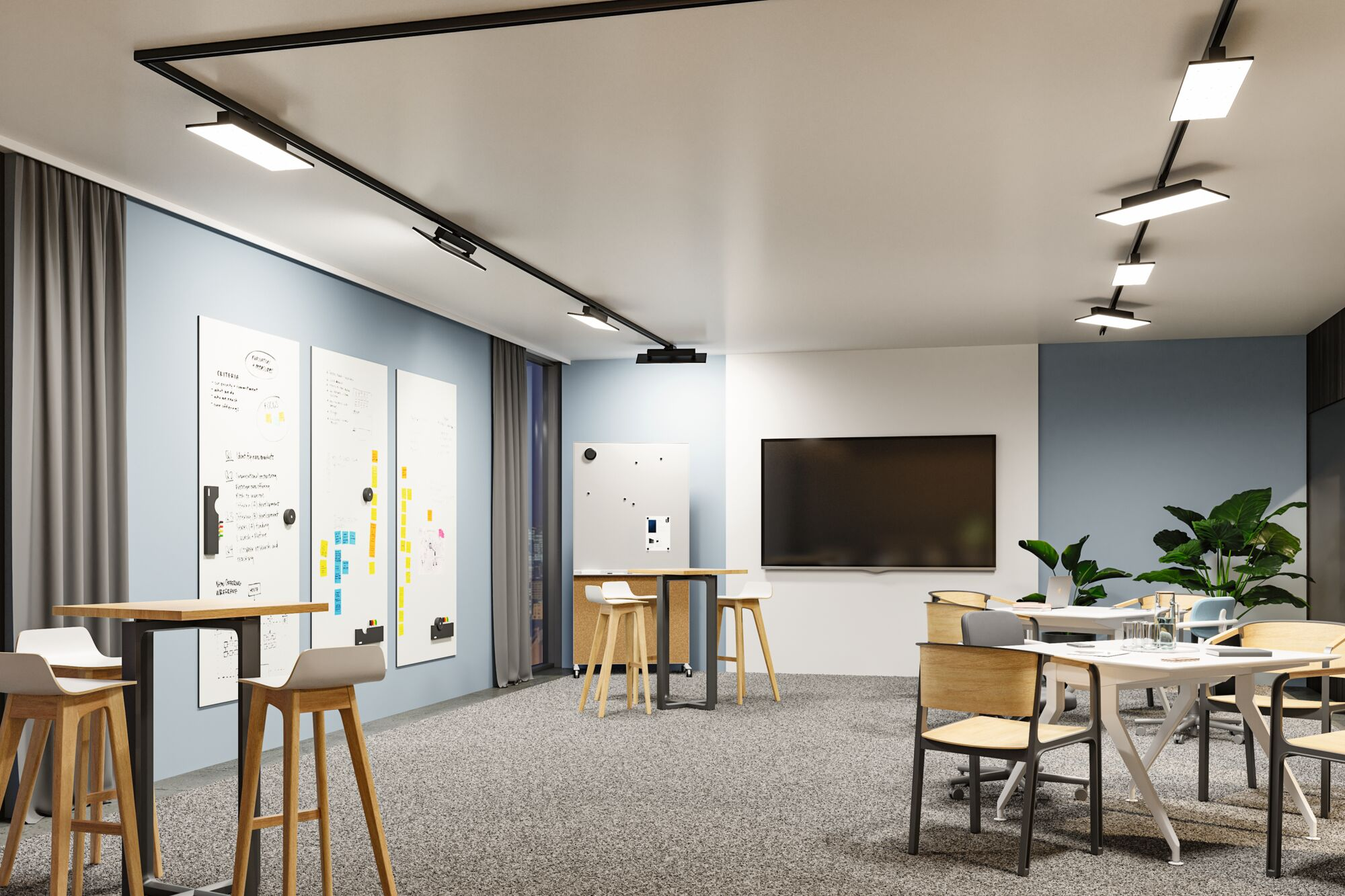 Nowoczesne biuro z tablicami, stołami, krzesłami i dużym ekranem.