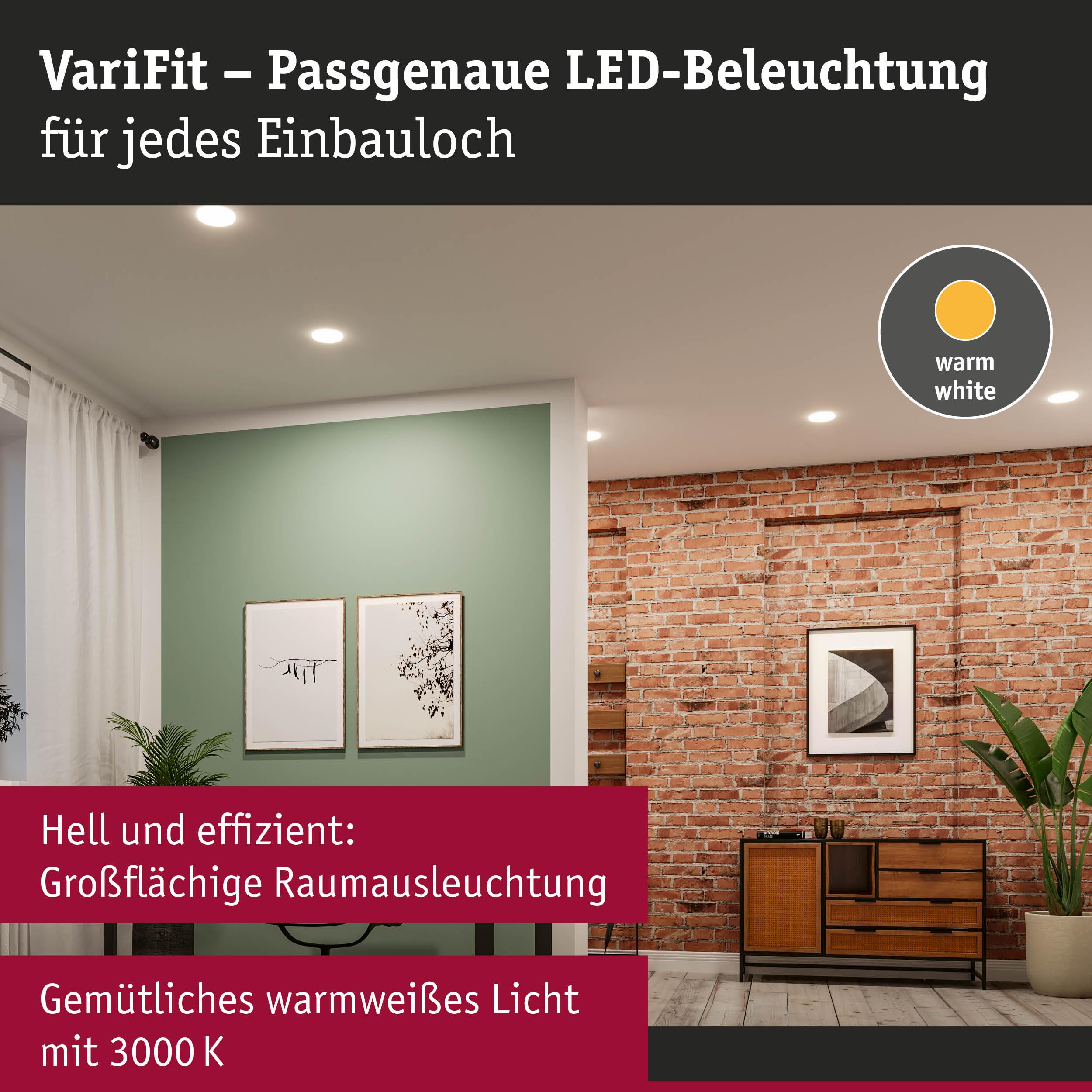 Ein heller Raum mit Deckenleuchten, Ziegelwand und Möbeln.
