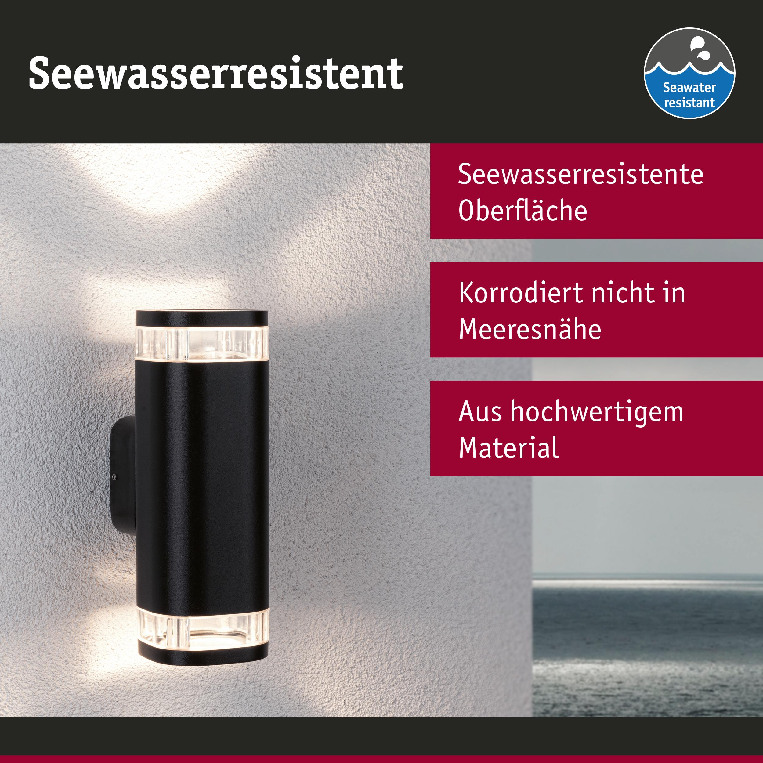 Schwarze Wandleuchte mit klaren Akzenten, leuchtet nach oben und unten.