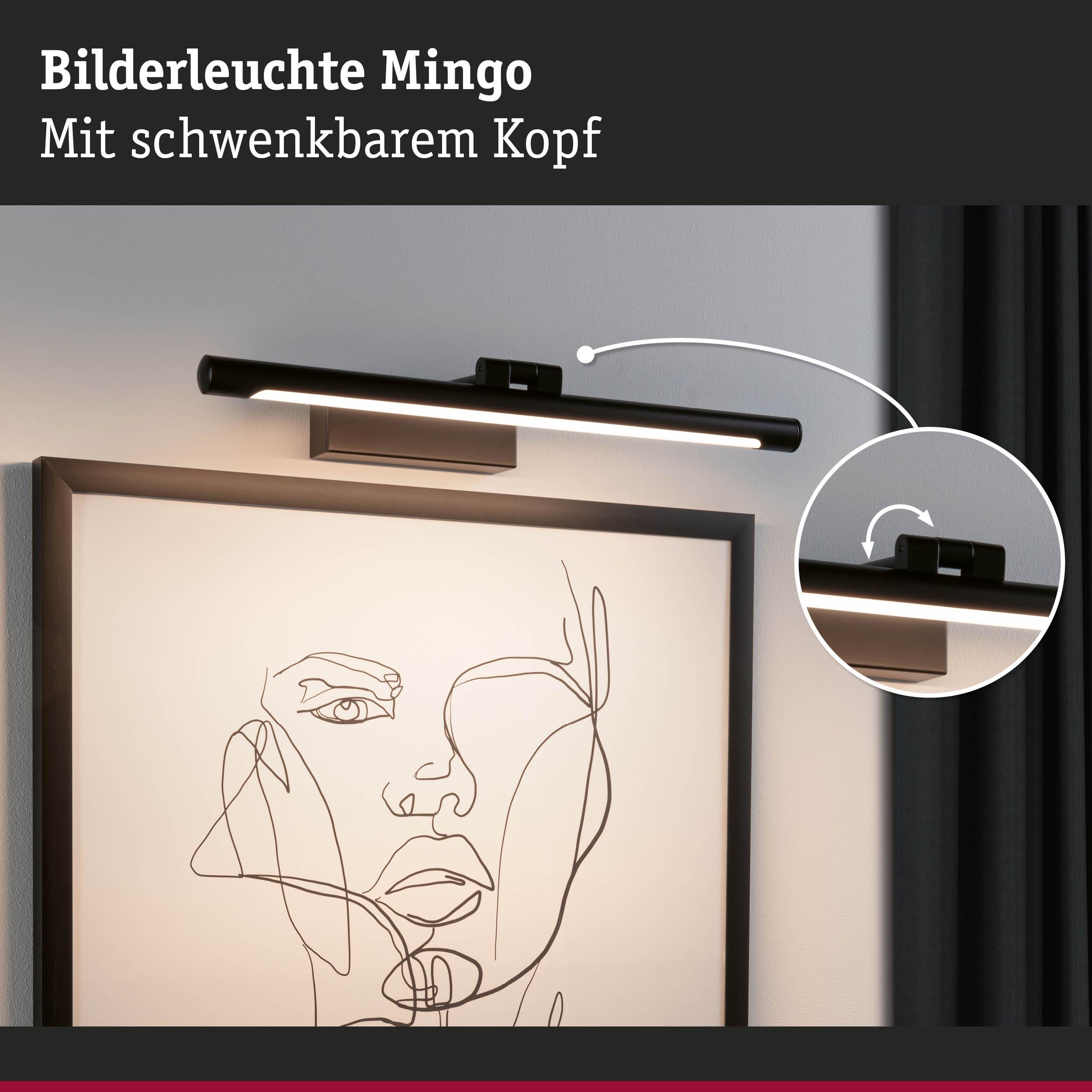 Eine schwarze Bilderleuchte mit schwenkbarem Kopf beleuchtet ein gerahmtes Strichmännchen-Porträt.