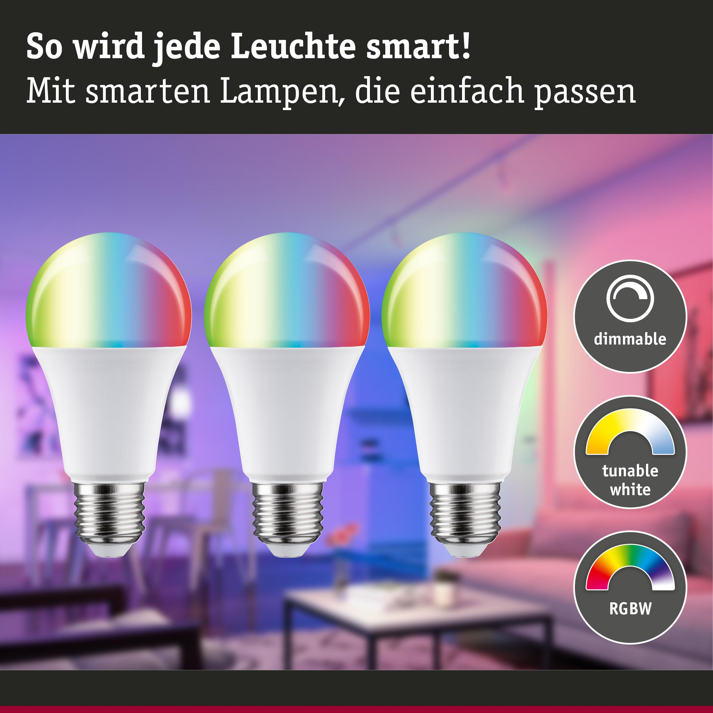 Drei smarte LED-Lampen in einem Wohnzimmer, die bunt leuchten.