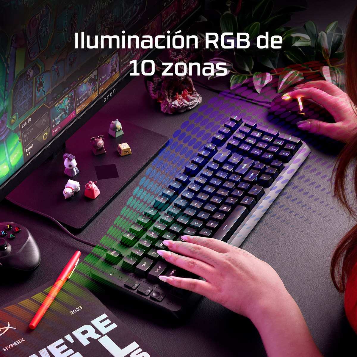Una persona juega en un teclado RGB iluminado, iluminando la pantalla.