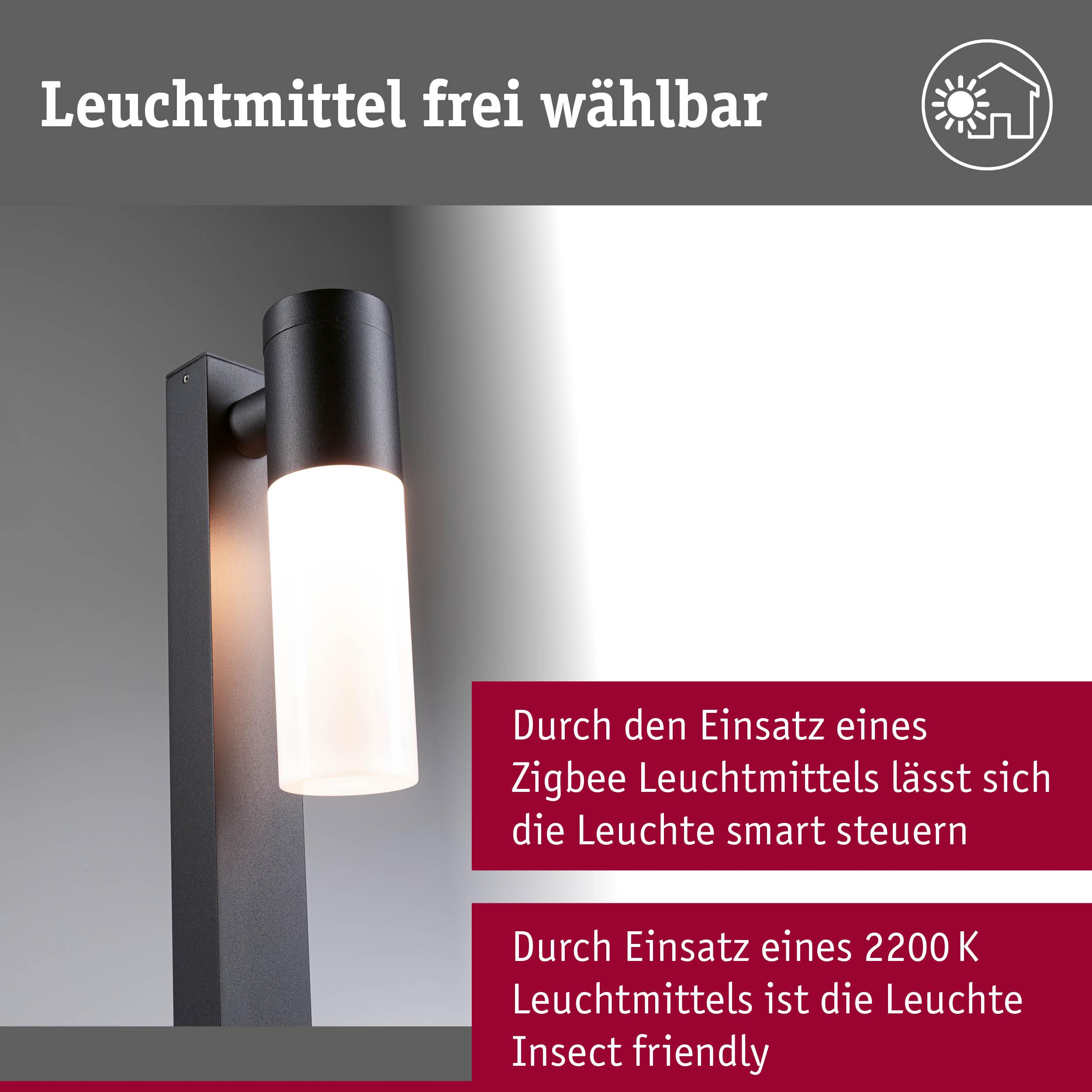 Nowoczesna lampa zewnętrzna z czarną podstawą i białym elementem świetlnym.