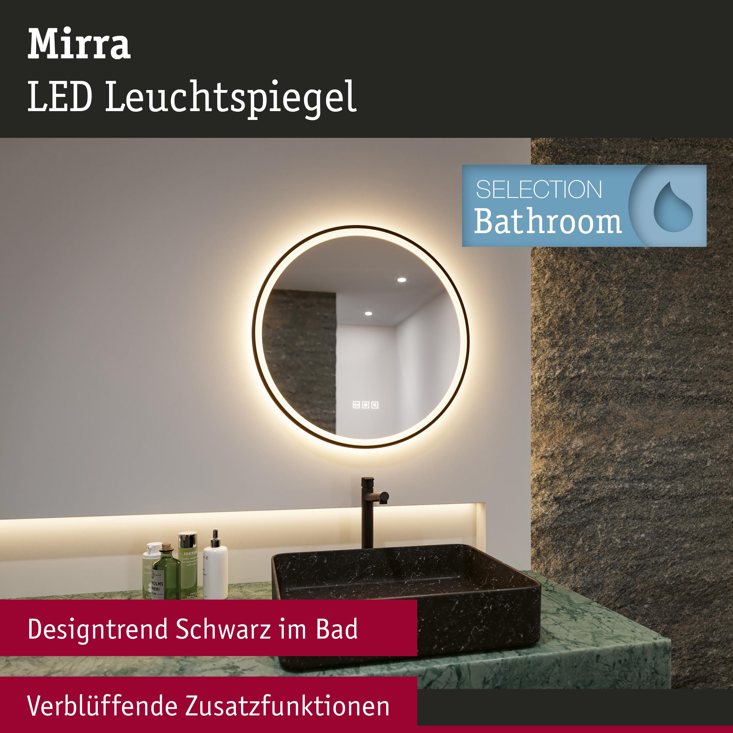 Moderner runder beleuchteter Spiegel über einem schwarzen Waschbecken mit Armatur.