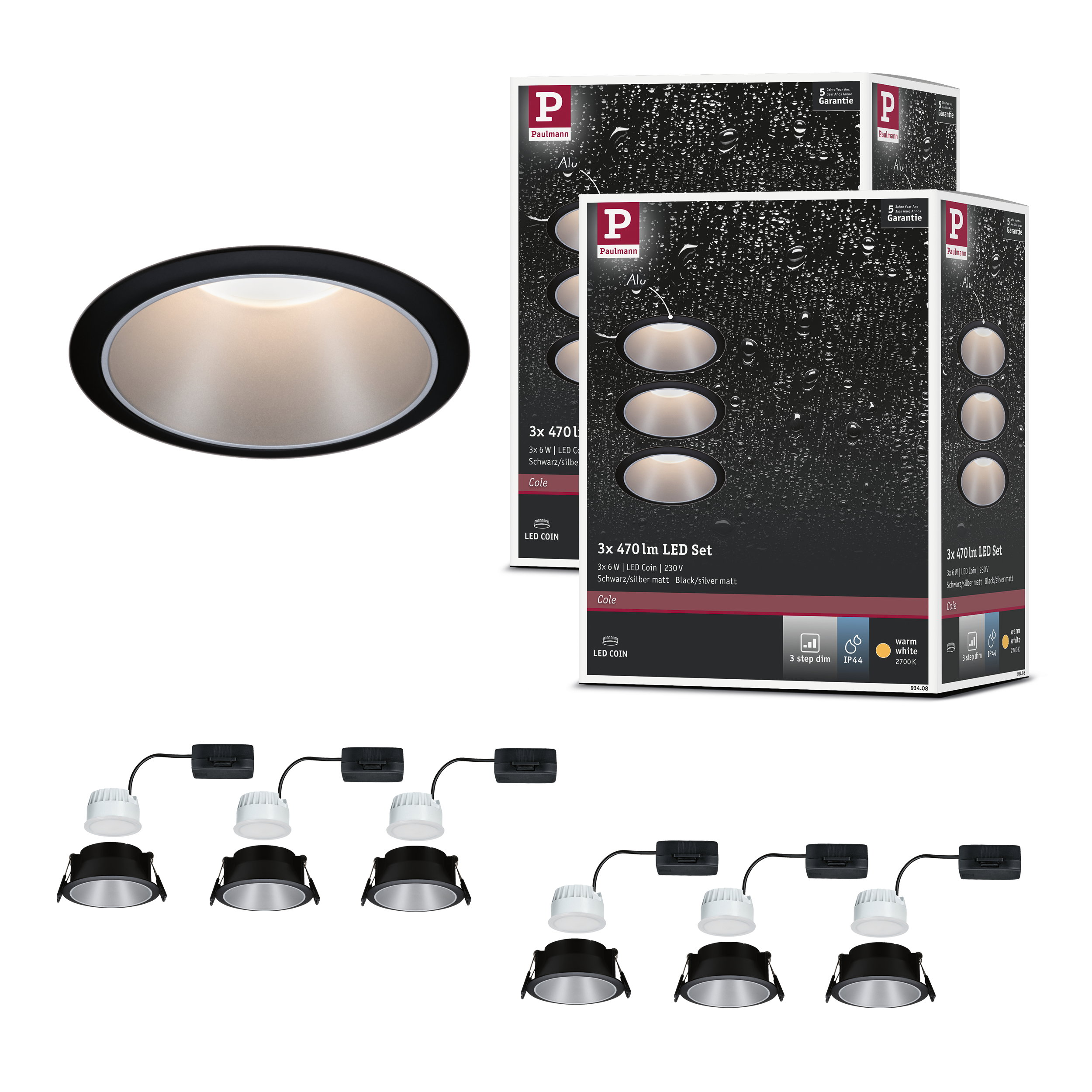 Zestaw lamp wpuszczanych z trzema czarno-srebrnymi spotami LED, opakowaniami i częściami.