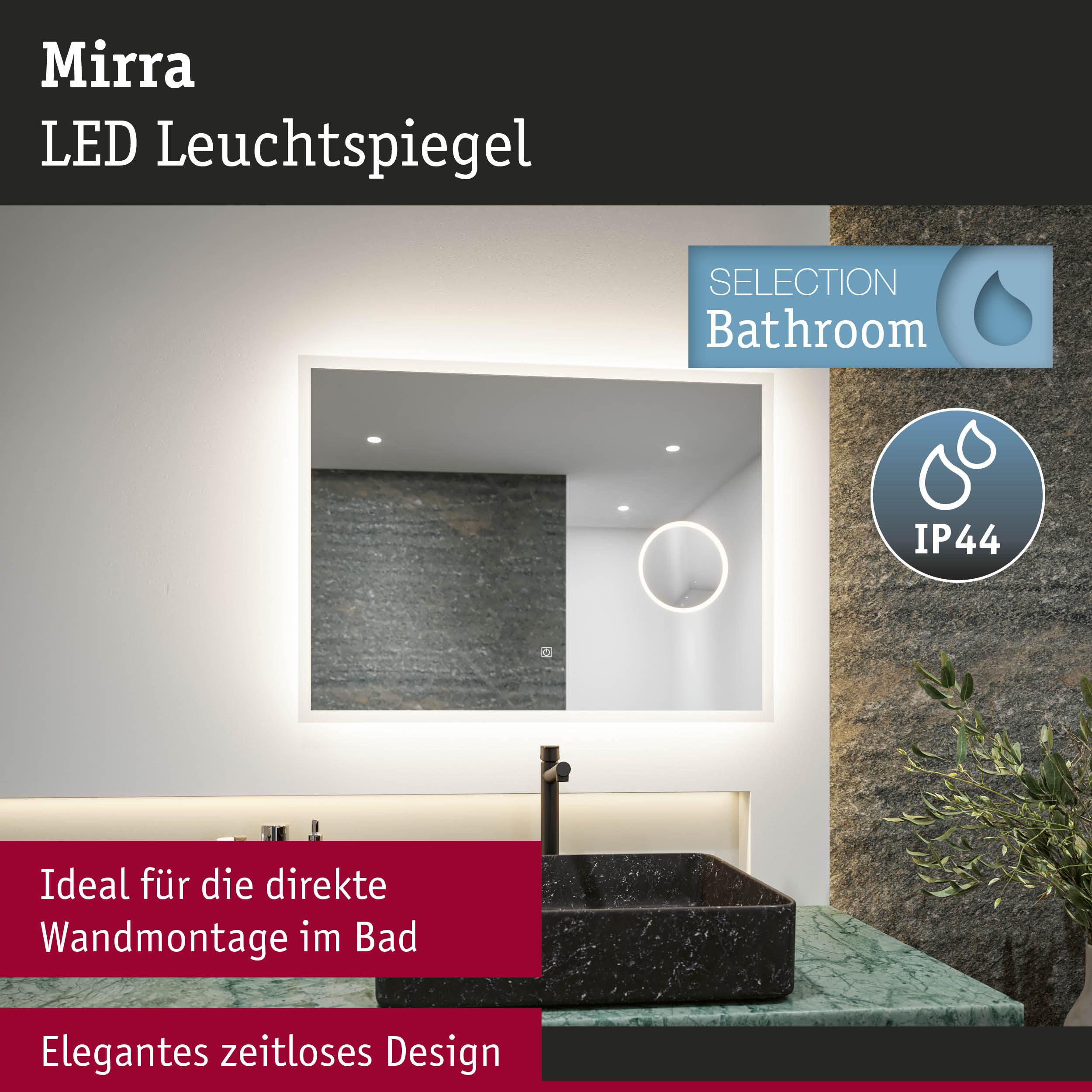 Ein beleuchteter Spiegel im modernen Badezimmer mit schwarzem Waschbecken.