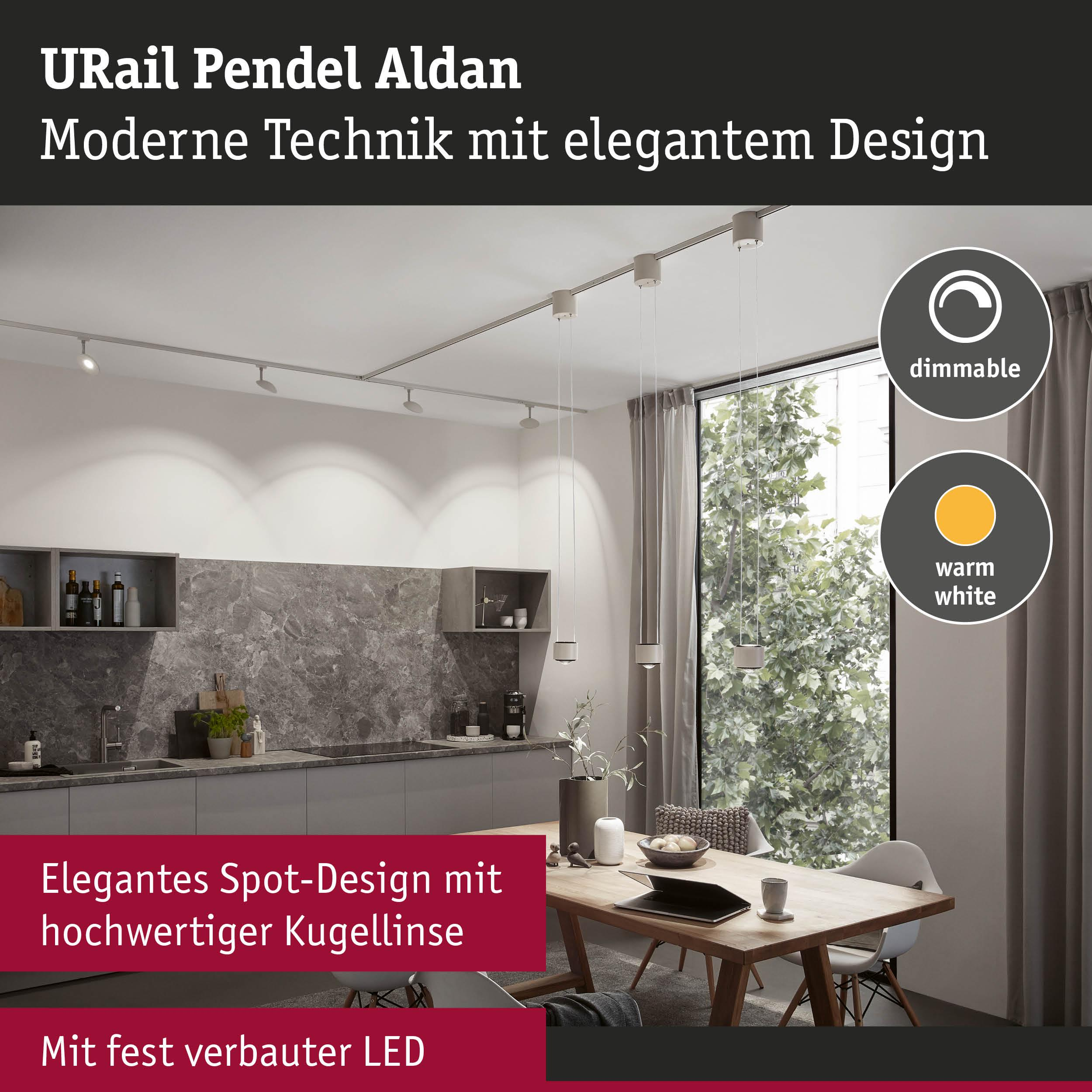 Moderne Pendelleuchten an einer Schiene in einer Küche mit Esstisch.