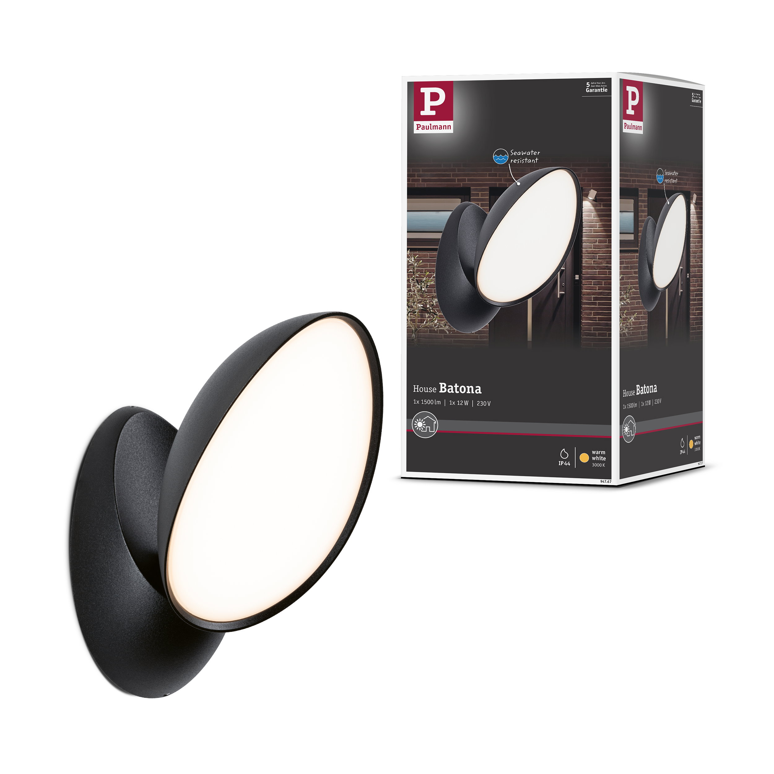 Czarna lampa ścienna z owalną, podświetlaną powierzchnią, obok opakowania.