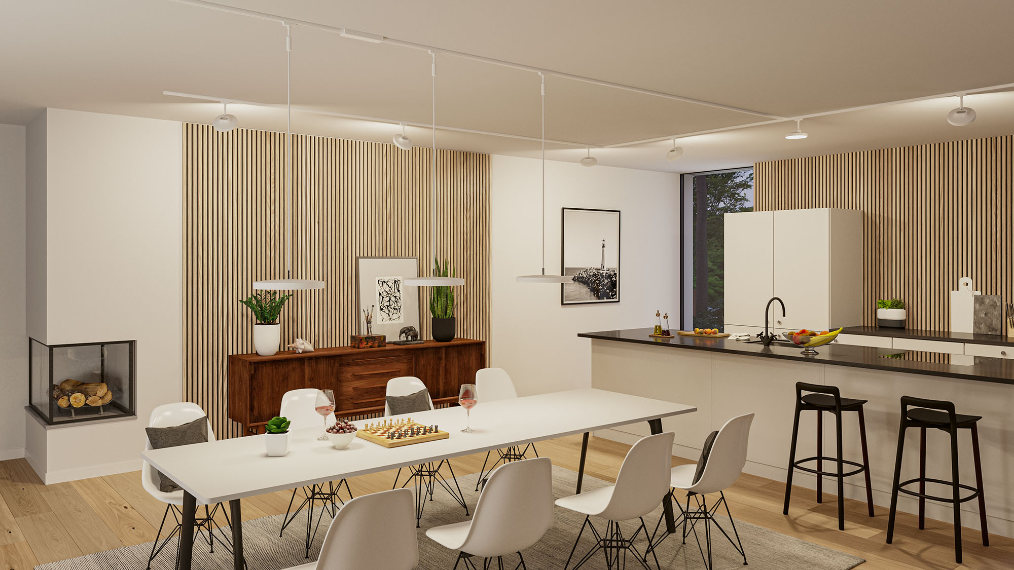 Ein Esszimmer mit Kamin, Holzwand und einer Küche. Ein weißer Tisch steht im Vordergrund.