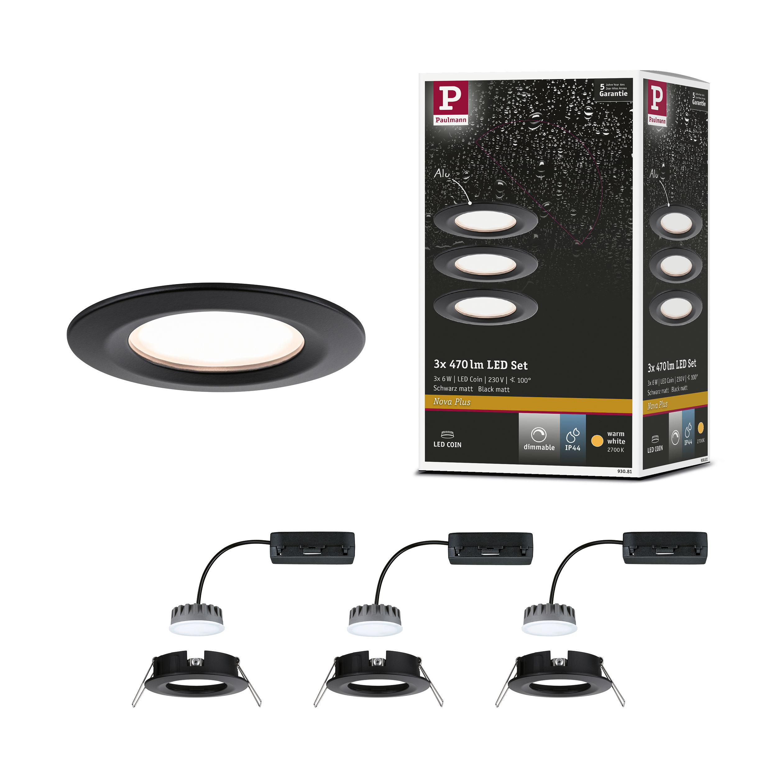 Pojedynczy czarny reflektor LED do zabudowy, obok opakowań i zdemontowanych zestawów.