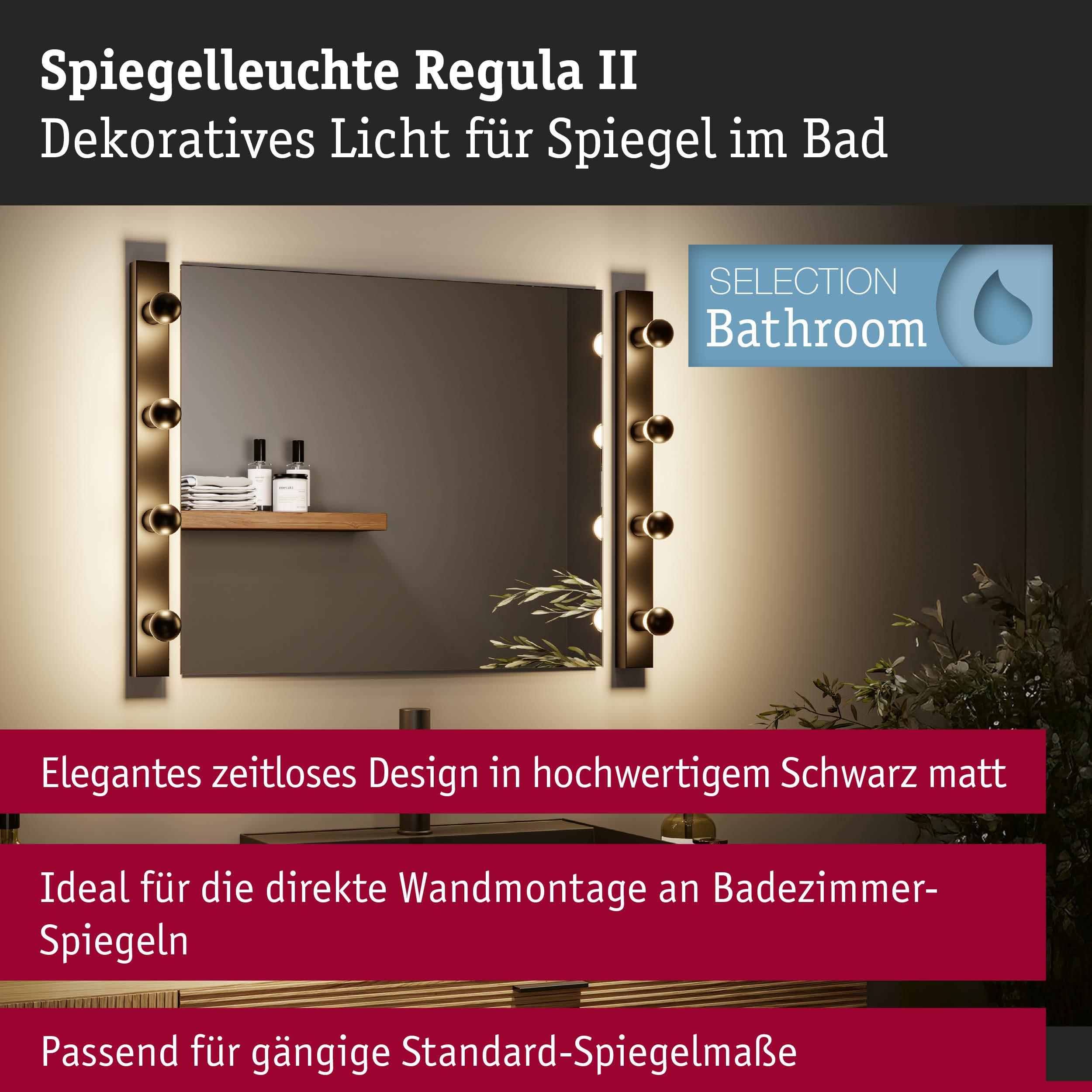 Badezimmerspiegel mit seitlichen Leuchten und Dekoration.