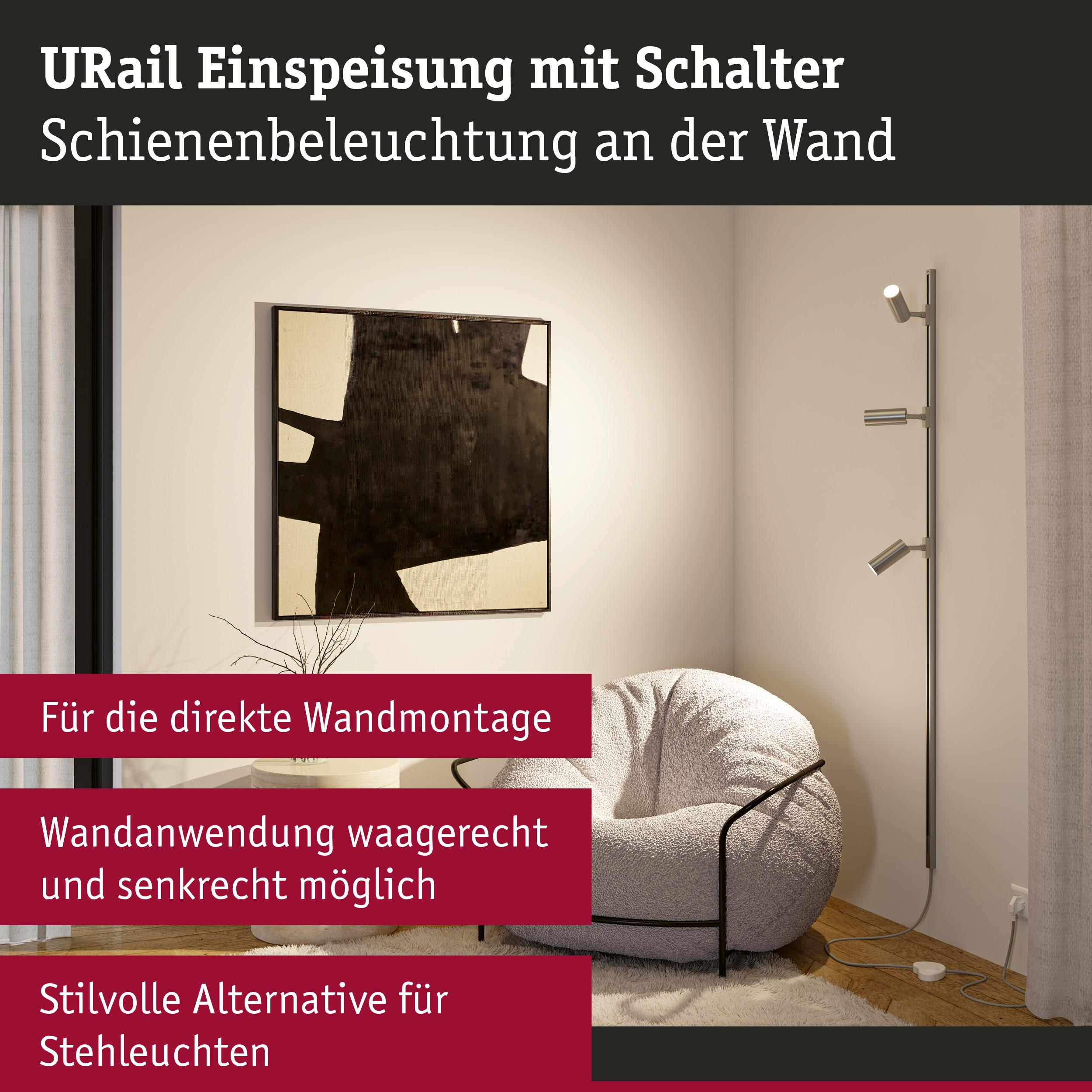 Modernes Wohnzimmer mit Bild, Hocker und Stehleuchte an der Wand.