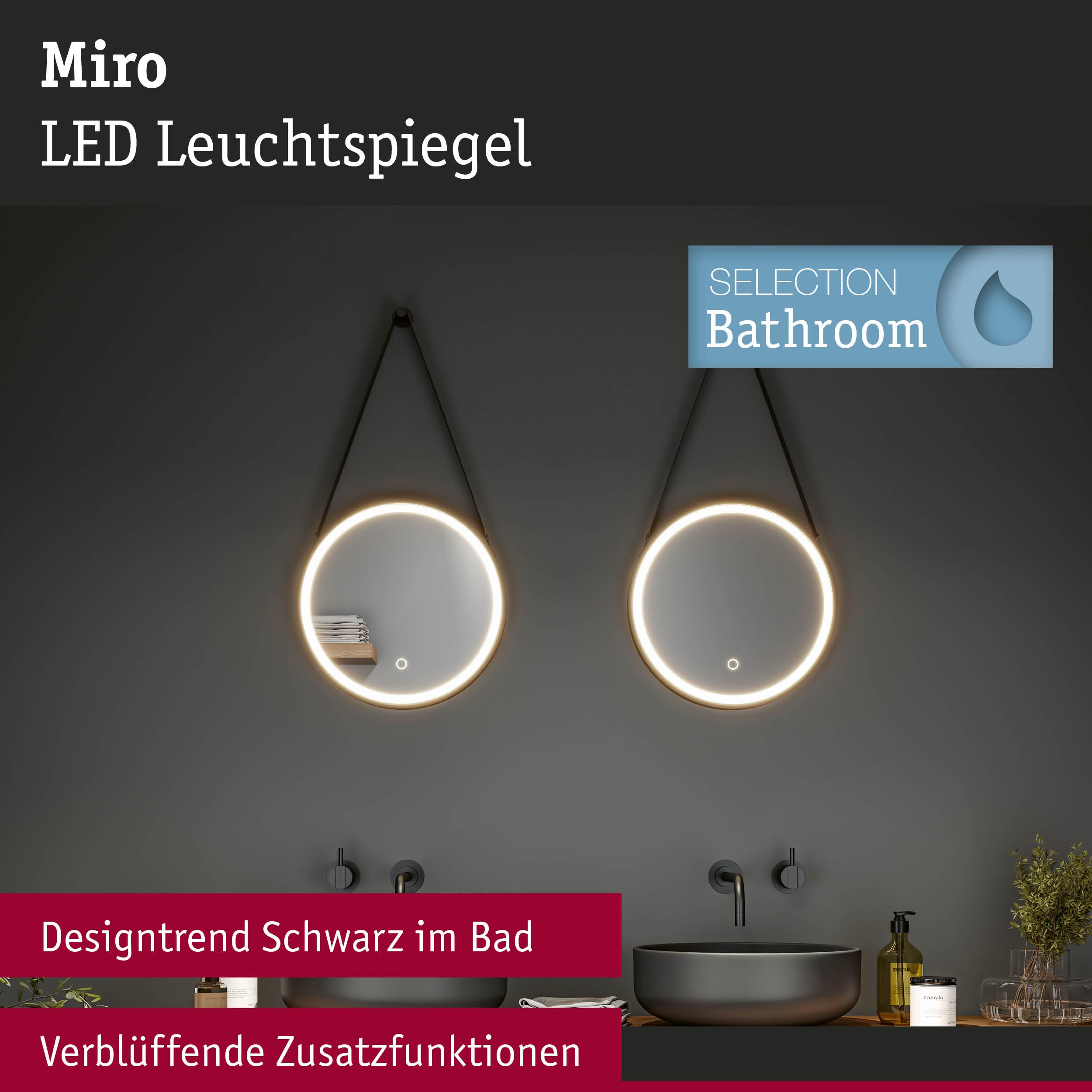 Zwei runde LED-Spiegel über schwarzen Waschbecken mit Armaturen.