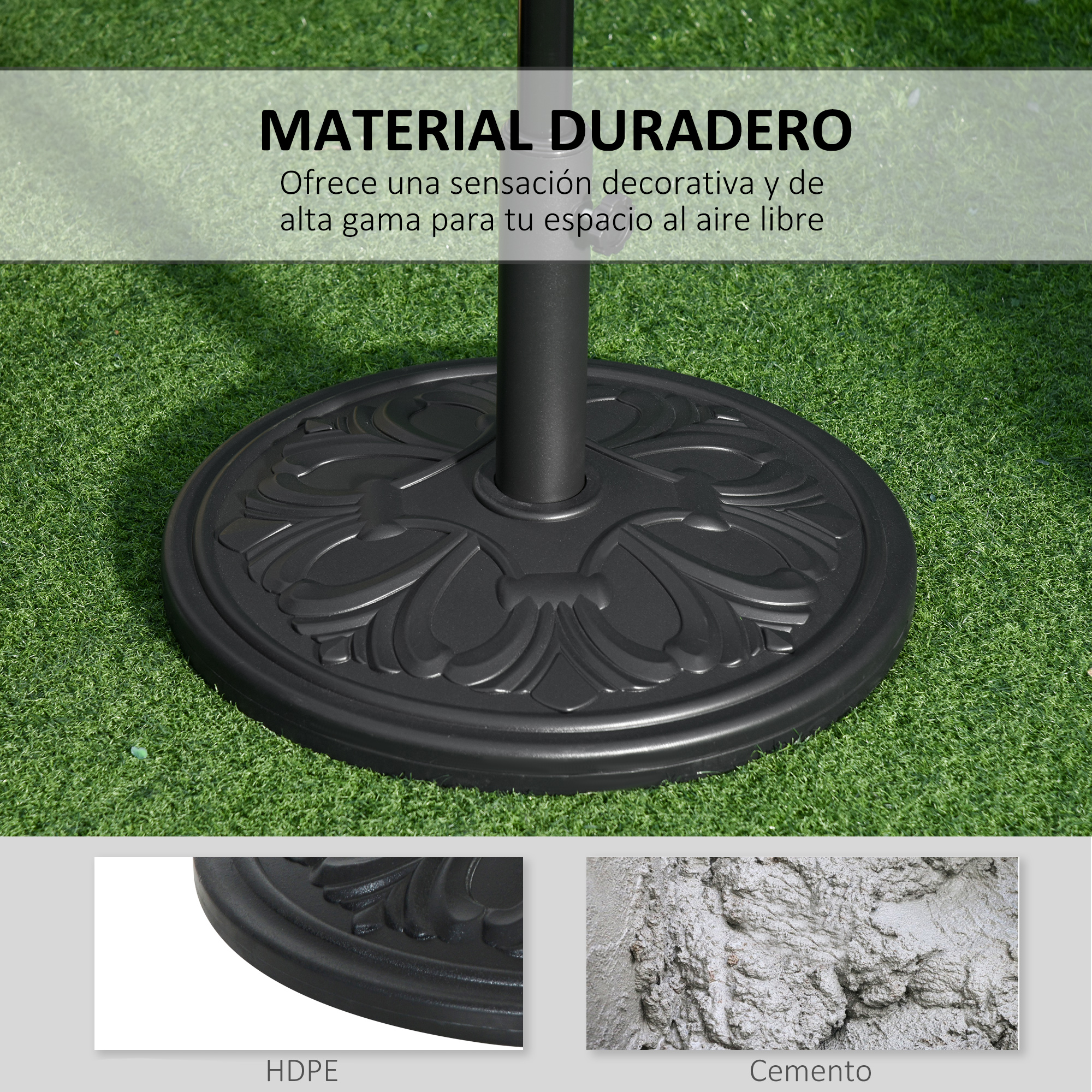 Base de sombrilla negra con patrón floral sobre césped artificial.