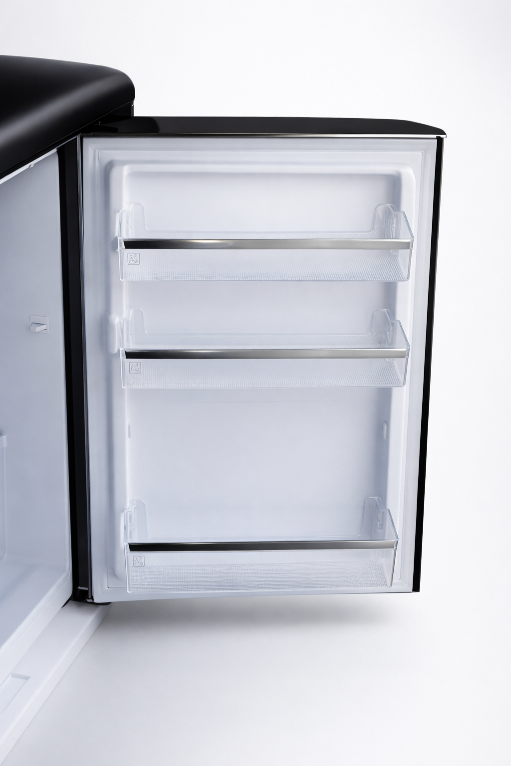 An empty black refrigerator with three clear shelves and silver trim.