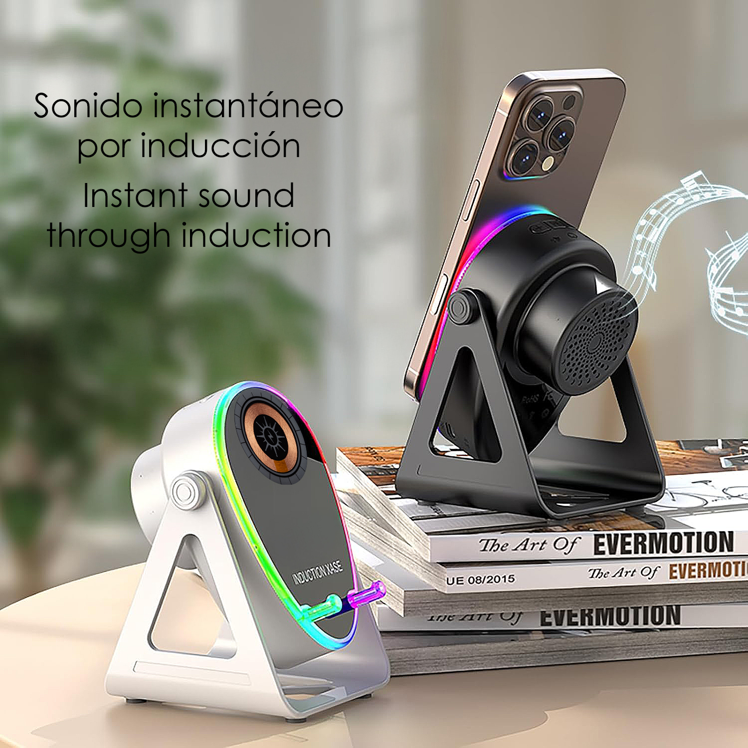 Due altoparlanti induttivi con luci colorate e uno smartphone su un supporto.