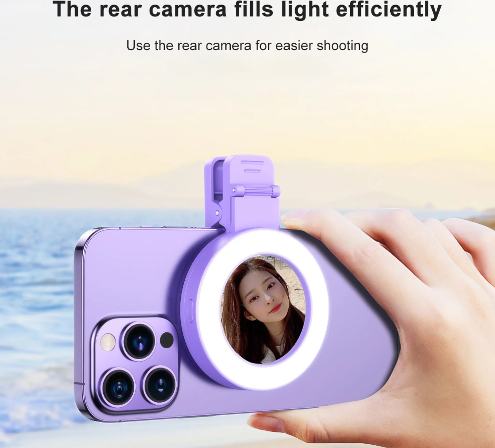 Ein lilafarbenes Smartphone mit Ringlicht-Aufsatz und einem Selfie einer Frau im Hintergrund.
