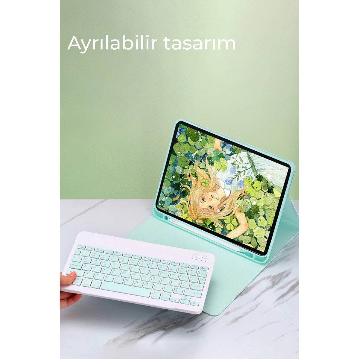 Kız resmi olan kılıflı tablet ve beyaz klavye.