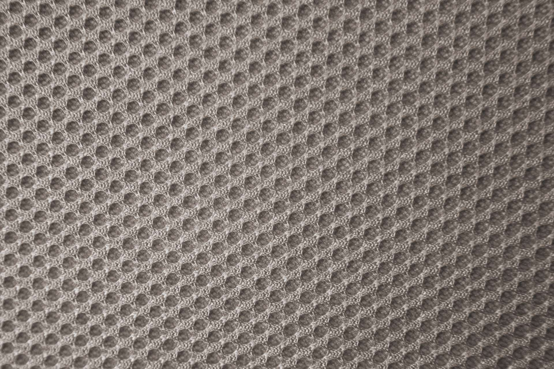 Tela gris con patrón de panal.