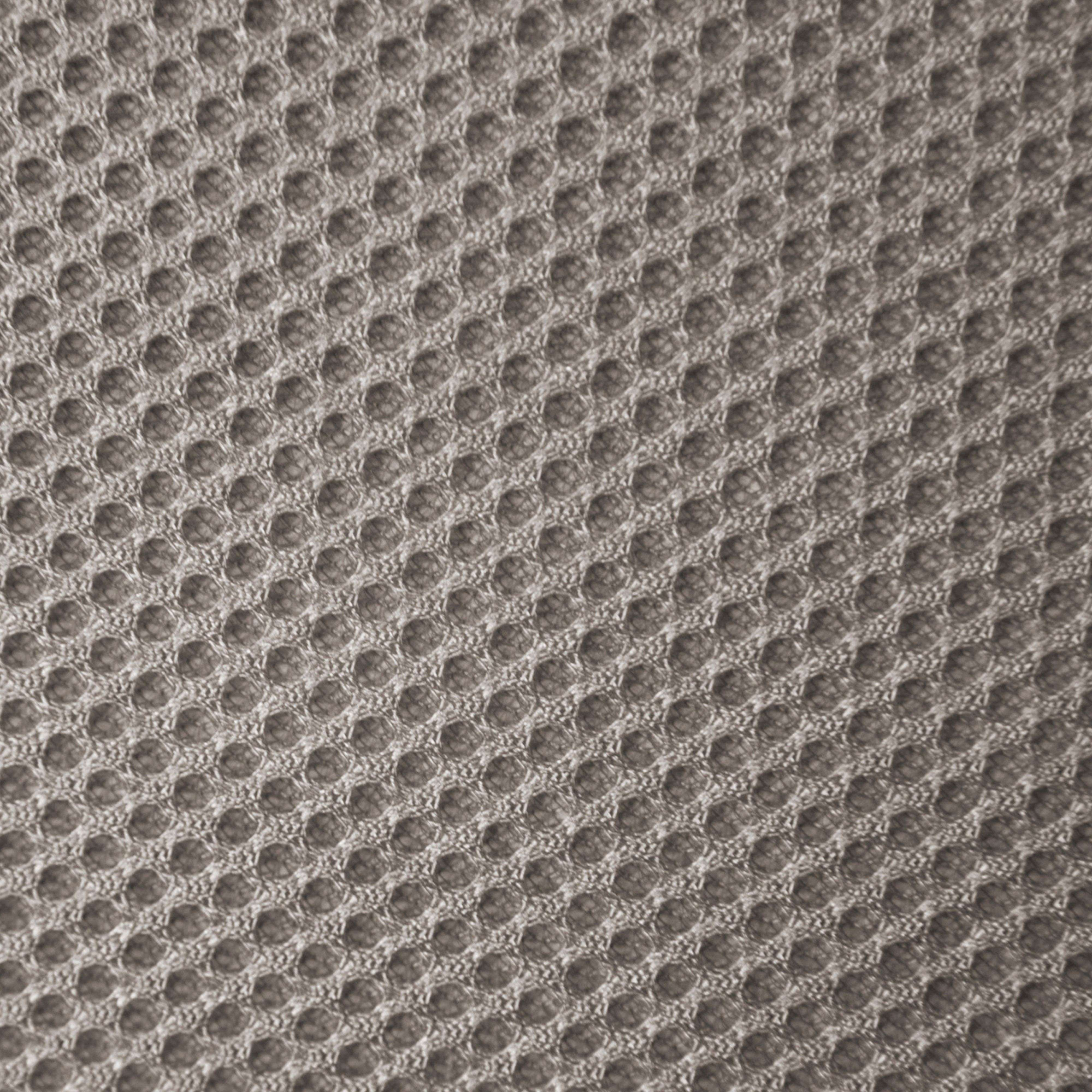 Textil gris con un patrón de panal de abejas de pequeños círculos.