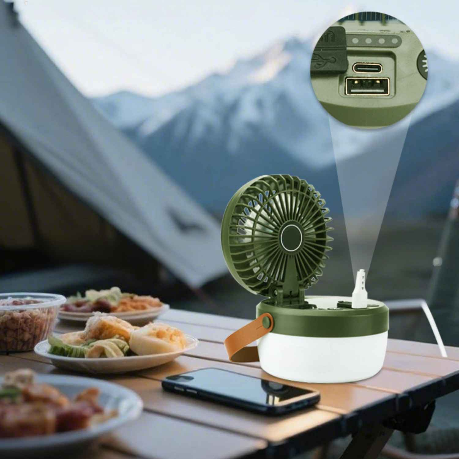 Ein Camping-Ventilator mit Licht, USB-Anschlüssen und Essen auf einem Tisch.