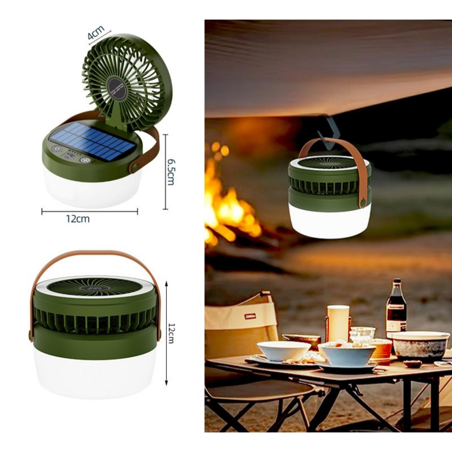 Grüne Campinglaterne mit Ventilator und Solarpanel, daneben ein Tisch mit Geschirr und Flasche.