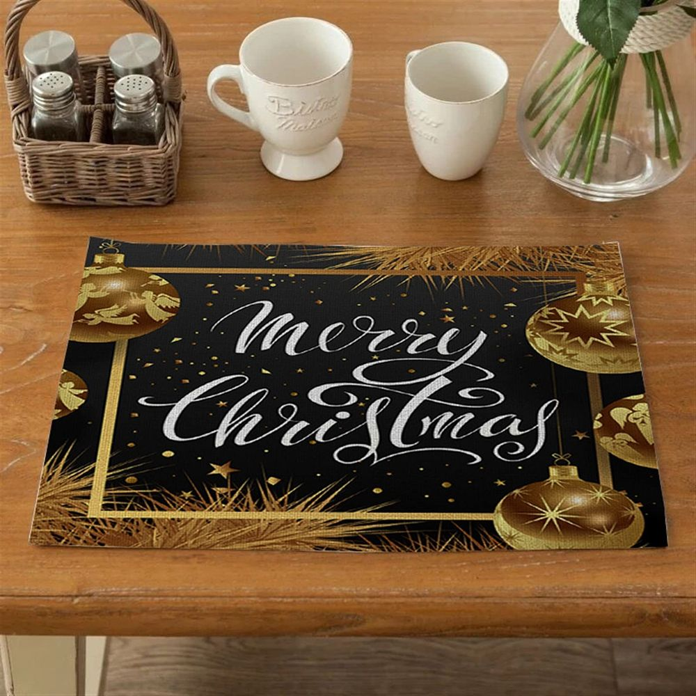 Schwarze Weihnachtsplatte mit goldenen Ornamenten und Schriftzug "Merry Christmas".