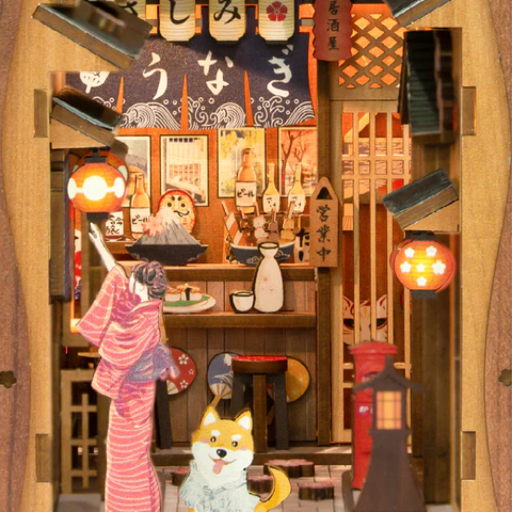 Scène miniature d'un restaurant japonais avec une femme en kimono et un chien.