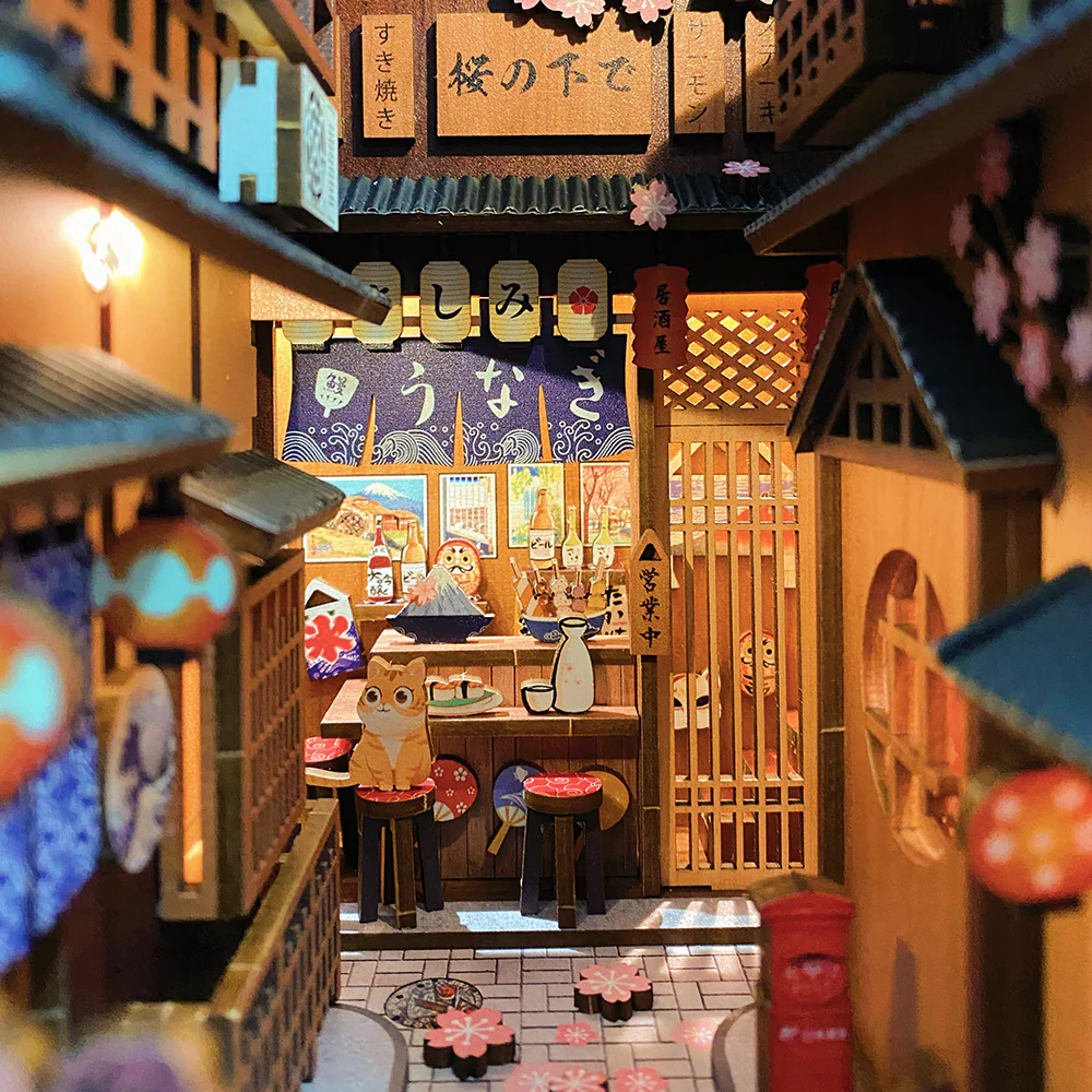 Vue de ruelle miniature avec boutique japonaise, chat, sushi et fleurs de cerisier.