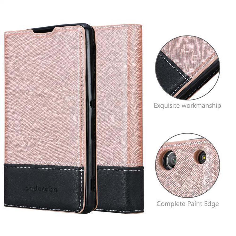 Una funda de teléfono rosa dorado y negro con costuras y recorte de cámara.