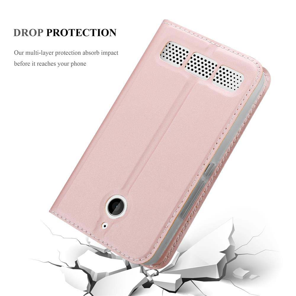 Una funda rosa para teléfono con recorte de cámara y orificios para altavoz, sobre suelo agrietado.