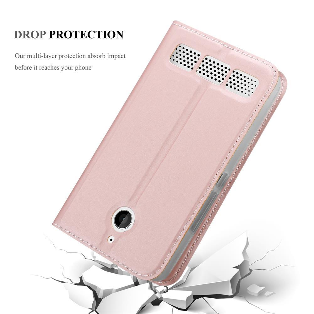 Una funda de teléfono rosa dorado con orificios para altavoces sobre fondo blanco.