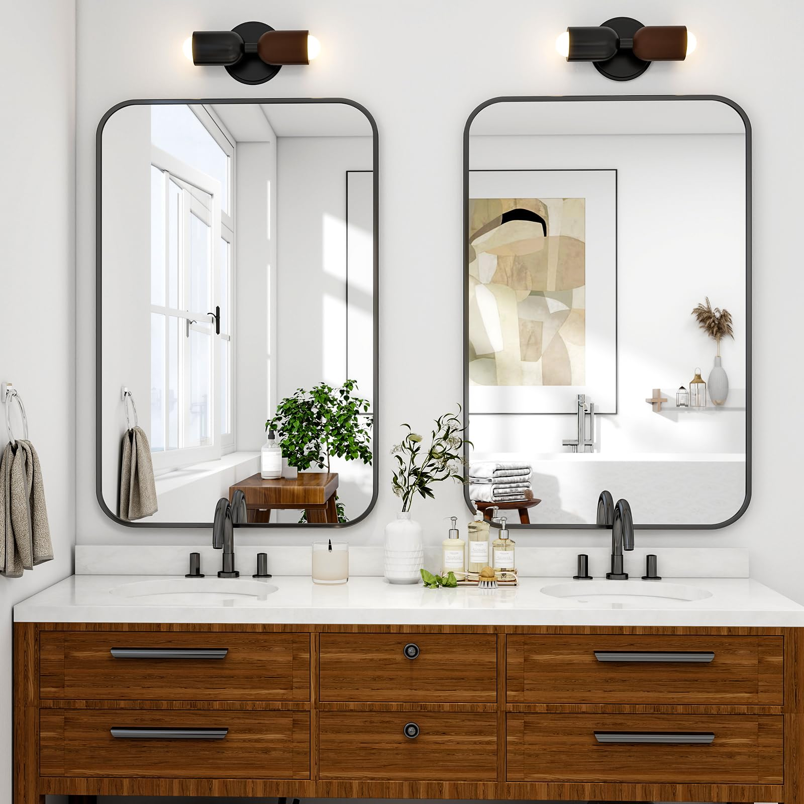 Doppelwaschbecken mit Holzunterschrank, Spiegeln und Wandleuchten.