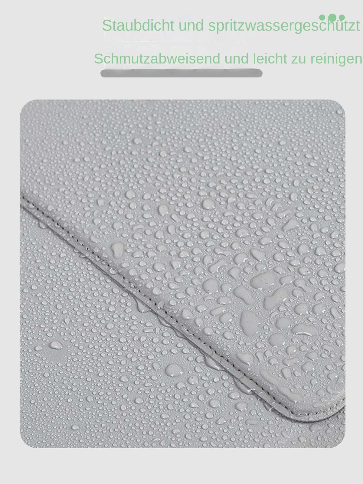 Graue Oberfläche mit vielen kleinen und großen Wassertropfen. Naht verläuft diagonal.