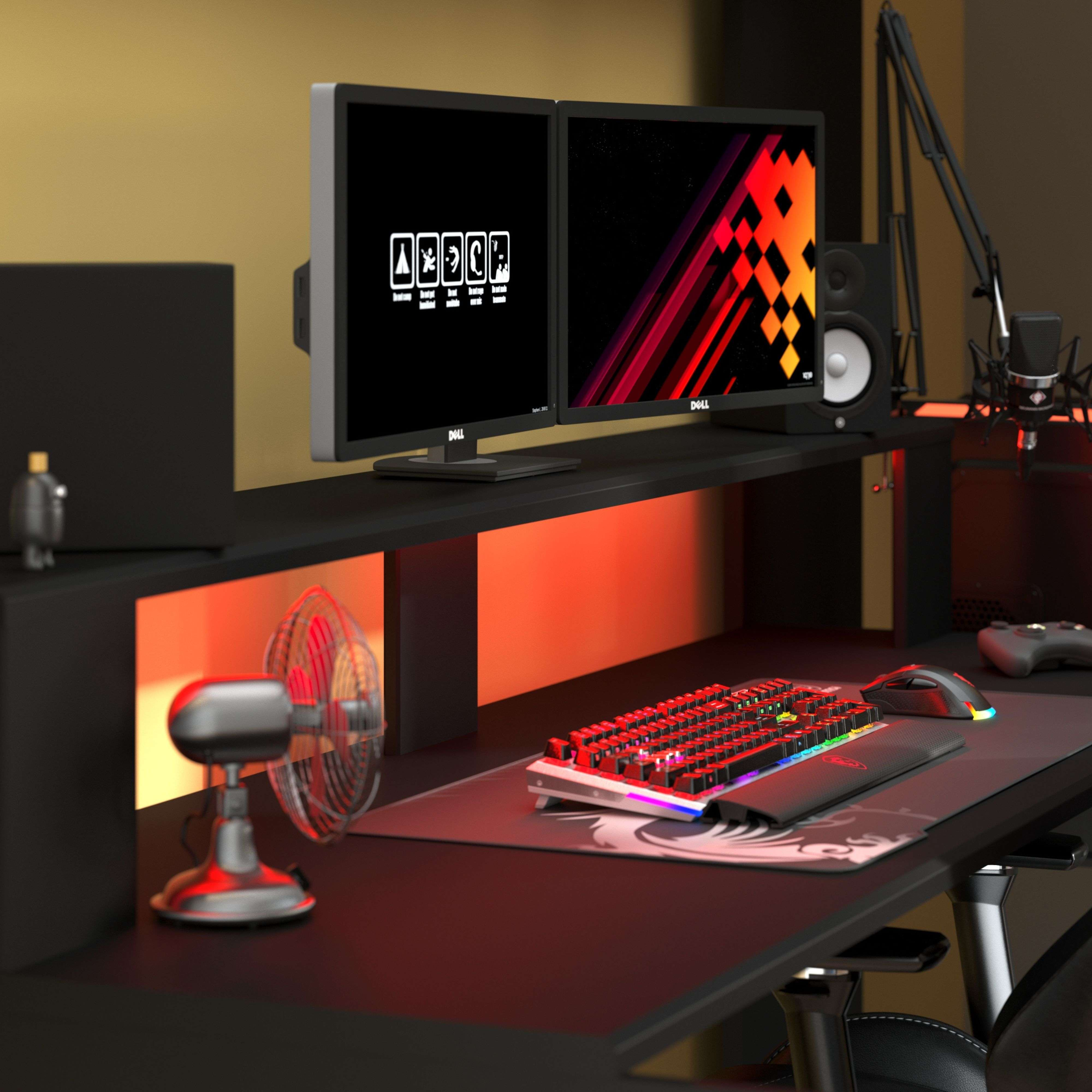 Una configuración de juego con dos monitores, teclado, ratón, micrófono y ventilador.