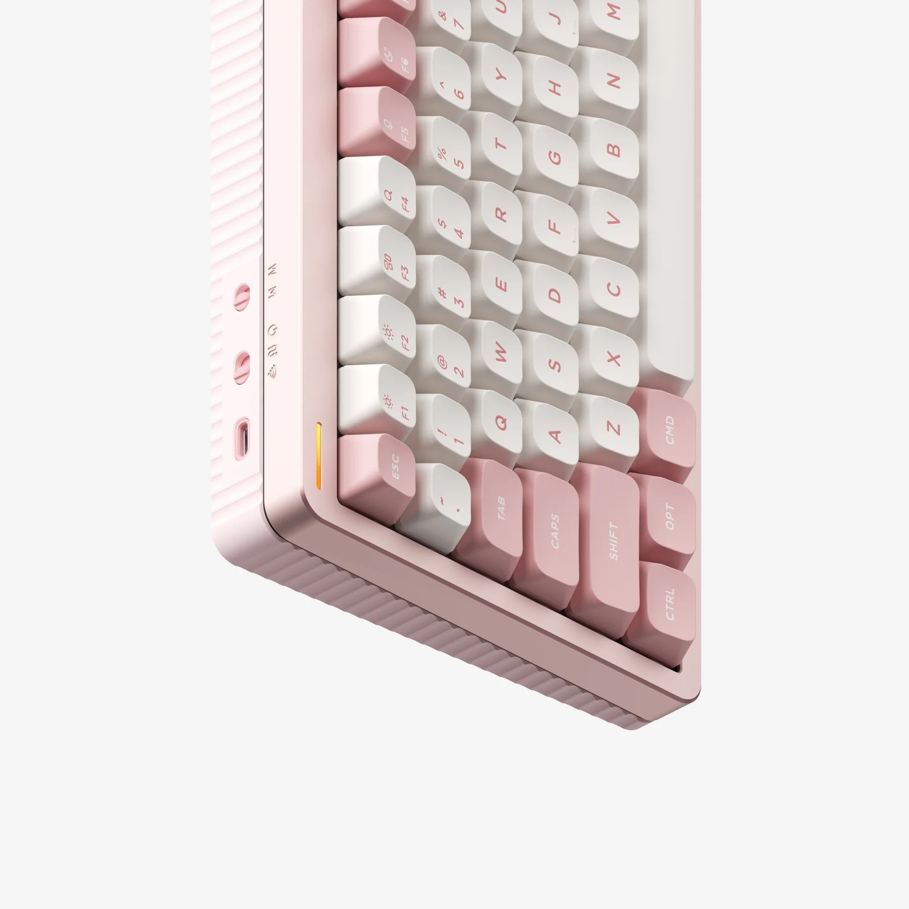 Różowa klawiatura z białymi i różowymi klawiszami, zbliżenie.
