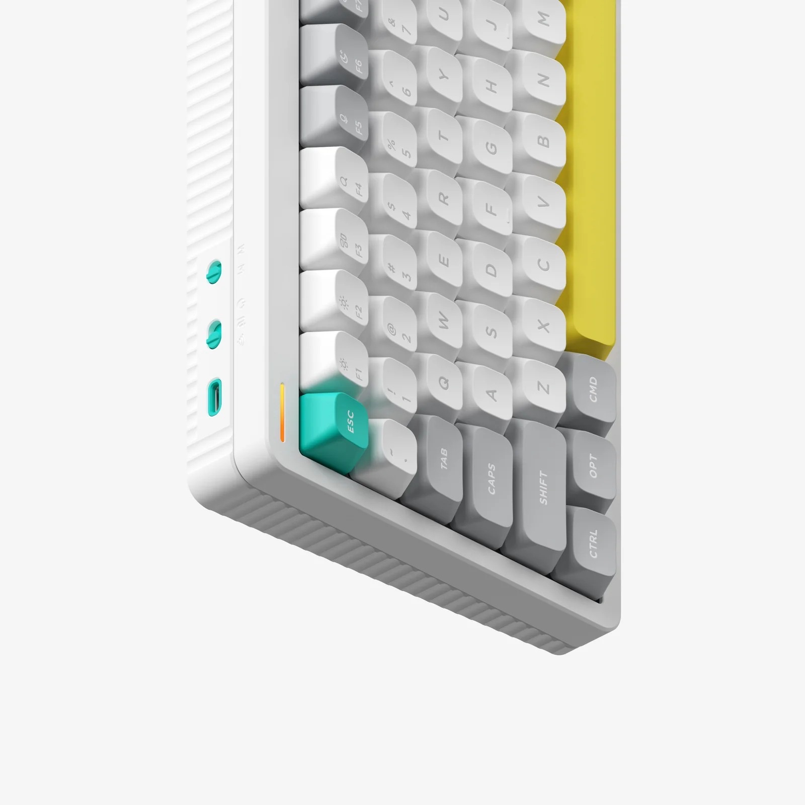Biała klawiatura z żółtym akcentem po prawej i niebieskimi portami z boku.