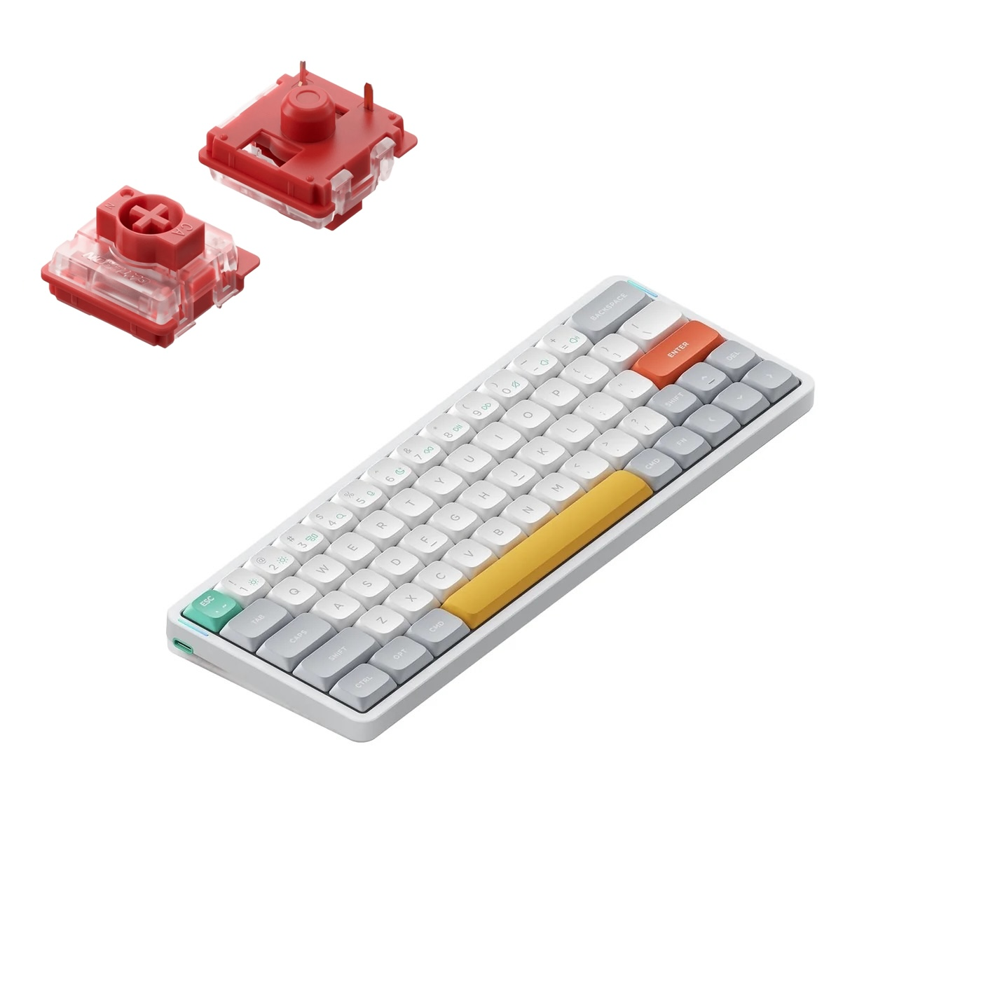 Czerwone przełączniki klawiatury mechanicznej i kompaktowa klawiatura biało-szaro-pomarańczowa.