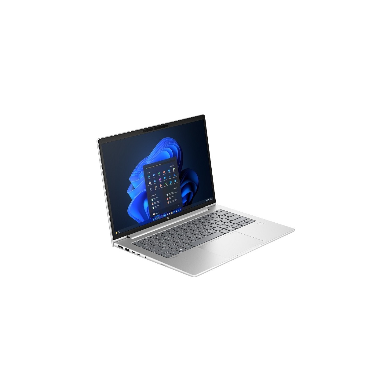 Windows 11 başlangıç menüsünü gösteren açık ekranlı gümüş rengi dizüstü bilgisayar.