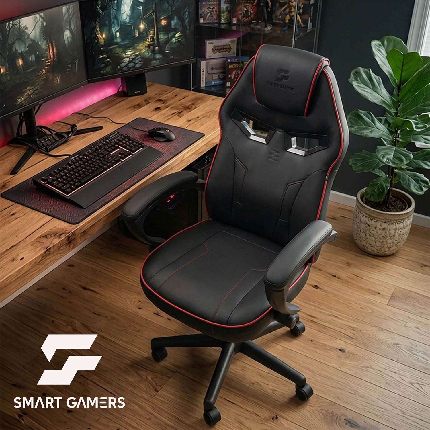 Czarny fotel gamingowy z czerwonymi wstawkami obok biurka z dwoma monitorami i rośliną.