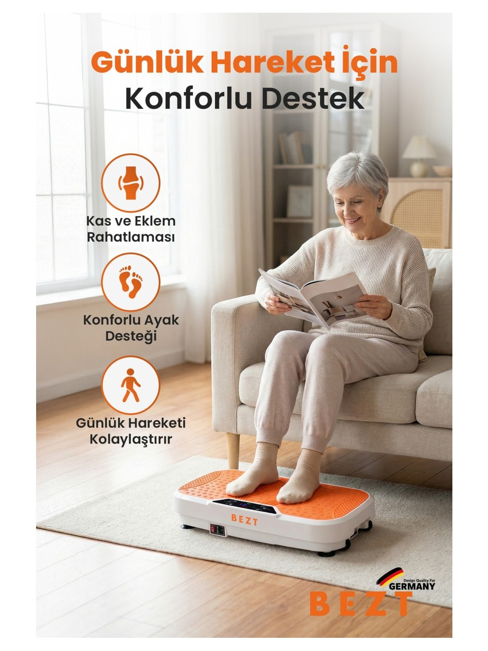 Yaşlı kadın kanepede oturmuş kitap okuyor, ayakları titreşimli platformda.