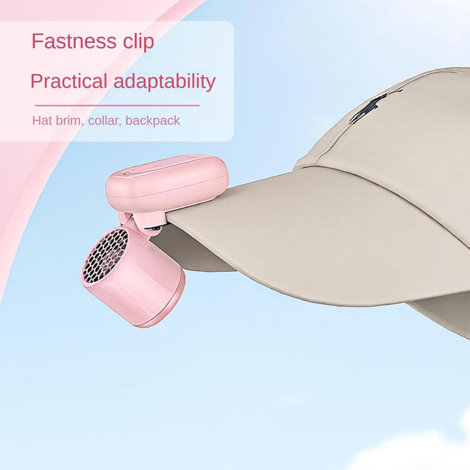 Pinker Clip-On-Ventilator an einer beige Kappe befestigt, vor Himmel.