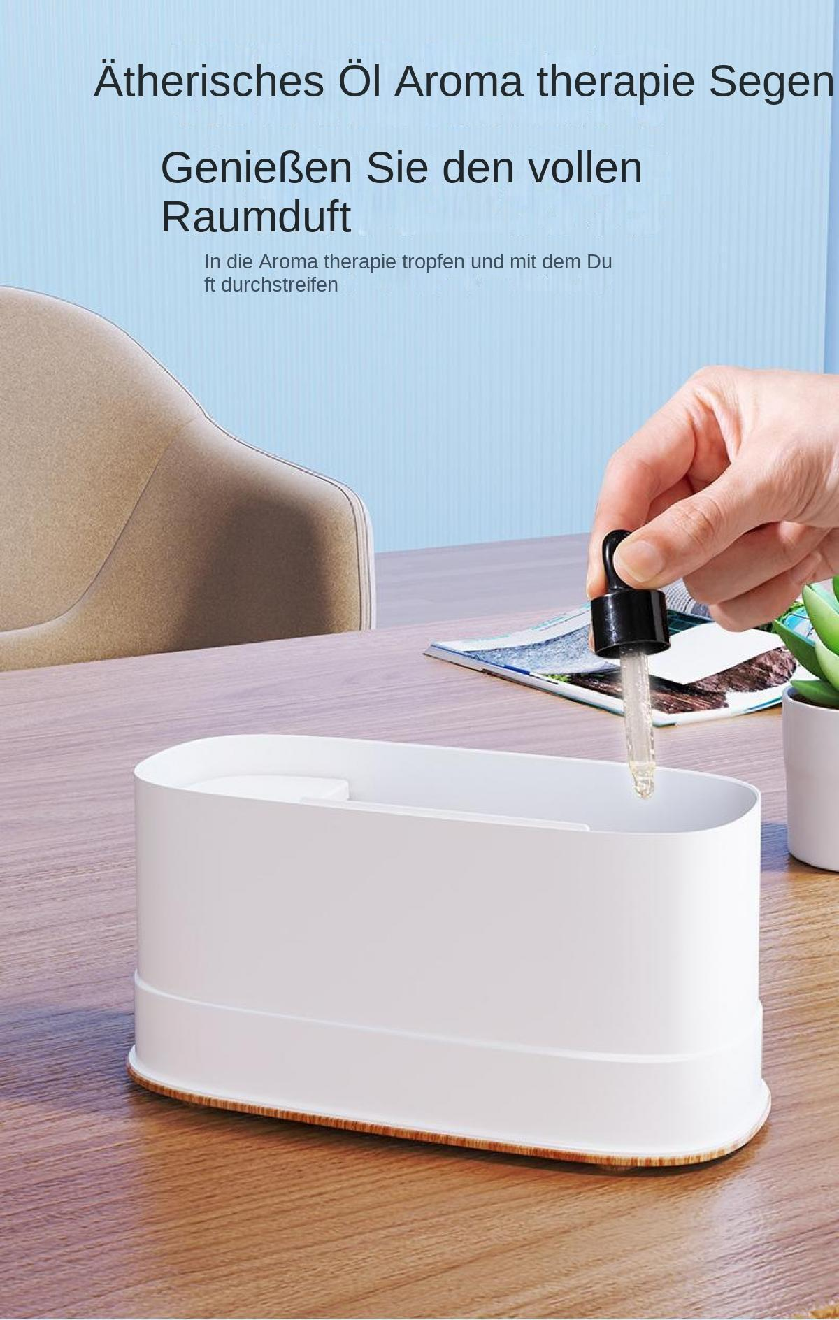 Ein Tropfer mit Öl wird über einen weißen Diffusor gehalten.